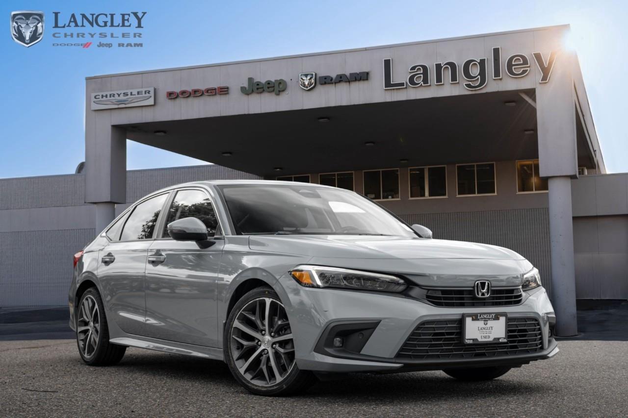 <p><strong>2022 Honda Civic Touring</strong></p><p>The 2022 Honda Civic Touring is a sophisticated and highly refined compact sedan that offers a perfect balance of spirited performance, modern design, and premium interior technology.</p><ul><li><p>Engine: 1.5L Turbocharged 4-cylinder (180 hp, 177 lb-ft torque)</p></li><li><p>Transmission: Continuously Variable Transmission (CVT)</p></li><li><p>Drivetrain: Front-Wheel Drive</p></li><li><p>Infotainment: 9-inch touchscreen with Bose 12-speaker premium audio</p></li><li><p>Safety: Honda Sensing suite of driver-assist features</p></li></ul><p>Come book a test drive at Langley Chrysler, conveniently located in Langley, British Columbia.</p>

<p>*All prices plus applicable taxes, applicable environmental recovery charges, documentation of $599 and full tank of fuel surcharge of $76 if a full tank is chosen. <br />Other protection items available that are not included in the above price:<br />Tire & Rim Protection and Key fob insurance starting from $599<br />Service contracts (extended warranties) for coverage up to 7 years and 200,000 kms starting from $599<br />Custom vehicle accessory packages, mudflaps and deflectors, tire and rim packages, lift kits, exhaust kits and tonneau covers, canopies and much more that can be added to your payment at time of purchase<br />Undercoating, rust modules, and full protection packages starting from $199<br />Financing Fee of $500 when applicable<br />Flexible life, disability and critical illness insurances to protect portions of or the entire length of vehicle loan</p>