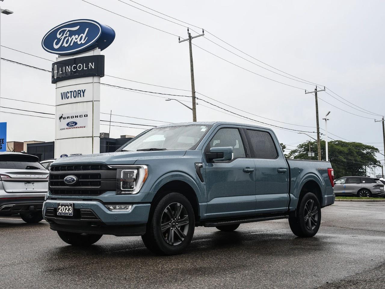 <h2>NOW AVAILABLE AT VICTORY FORD LINCOLN</h2><h1>2023 Ford F-150 Lariat SuperCrew 4x4 502A</h1><h3>502A Equipment Group  Twin Panel Moonroof  Sport Appearance Package  Premium Full-Size Pickup</h3><p>This 2023 Ford F-150 Lariat SuperCrew 4x4 502A combines premium comfort, advanced technology, and legendary F-Series capability. Equipped with the desirable 502A Equipment Group, Twin Panel Moonroof, and Sport Appearance Package, this truck offers bold styling, luxurious amenities, and the versatility to tackle work or weekend adventures with confidence.</p><h3>POWER & PERFORMANCE</h3><ul><li><p>2.7L EcoBoost® Turbocharged V6 Engine</p></li><li><p>10-Speed Automatic Transmission</p></li><li><p>Electronic Shift-On-The-Fly 4x4</p></li><li><p>Selectable Drive Modes</p></li><li><p>Trailer Sway Control</p></li></ul><h3>PACKAGE</h3><ul><li><p>502A High Equipment Group</p></li><li><p>Sport Appearance Package</p></li><li><p>Twin Panel Moonroof</p></li><li><p>Heated & Ventilated Front Seats</p></li><li><p>Heated Steering Wheel</p></li><li><p>Remote Start System</p></li></ul><h3>EXTERIOR FEATURES</h3><ul><li><p>20" Dark-Finished Aluminum Wheels</p></li><li><p>Sport Appearance Package Body-Colour Bumpers</p></li><li><p>Twin Panel Moonroof</p></li><li><p>LED Projector Headlamps</p></li><li><p>Power Tailgate with Tailgate Step</p></li><li><p>Power-Folding Heated Side Mirrors</p></li></ul><h3>INTERIOR & COMFORT</h3><ul><li><p>Leather-Trimmed Seating Surfaces</p></li><li><p>Heated & Ventilated Front Seats</p></li><li><p>10-Way Power Driver & Passenger Seats</p></li><li><p>Heated Steering Wheel</p></li><li><p>Dual-Zone Automatic Climate Control</p></li><li><p>Spacious SuperCrew Cabin</p></li></ul><h3>TECHNOLOGY</h3><ul><li><p>SYNC® 4 with 12" Touchscreen</p></li><li><p>Connected Navigation</p></li><li><p>Apple CarPlay® & Android Auto</p></li><li><p>FordPass Connect with Wi-Fi Hotspot</p></li><li><p>B&O® Sound System by Bang & Olufsen</p></li><li><p>360-Degree Camera</p></li></ul><h3>SAFETY & DRIVER ASSISTANCE</h3><ul><li><p>Ford Co-Pilot360 Assist 2.0</p></li><li><p>Adaptive Cruise Control with Stop & Go</p></li><li><p>Blind Spot Information System (BLIS®) with Trailer Coverage</p></li><li><p>Lane Centering Assist</p></li><li><p>Pre-Collision Assist with Automatic Emergency Braking</p></li><li><p>360-Degree Camera</p></li><li><p>Reverse Brake Assist</p></li></ul><h3>HIGHLIGHTS</h3><ul><li><p>502A High Equipment Group</p></li><li><p>Twin Panel Moonroof</p></li><li><p>Sport Appearance Package</p></li><li><p>Leather-Trimmed Interior</p></li><li><p>B&O® Premium Audio</p></li><li><p>Legendary F-150 Capability</p></li></ul><h3>Special Offer:</h3><p><strong>Peace of Mind Included:</strong> 3-Month Comprehensive Warranty (for vehicles under 10 years old & under 160,000 km) No-Haggle, Live Market Pricing  Transparent & Competitive All-Inclusive Pricing: Fees, Reconditioning, and Full Detailing Included (Taxes & Licensing Extra)</p><h4>Additional Details:</h4><p><strong>Keys:</strong> Standard with one key. Additional keys (if provided by the previous owner) included at no cost. Optional key purchases available upon request.</p><p><strong>Visit Victory Ford Lincoln Today</strong> Schedule your appointment to experience this exceptional vehicle.</p>
