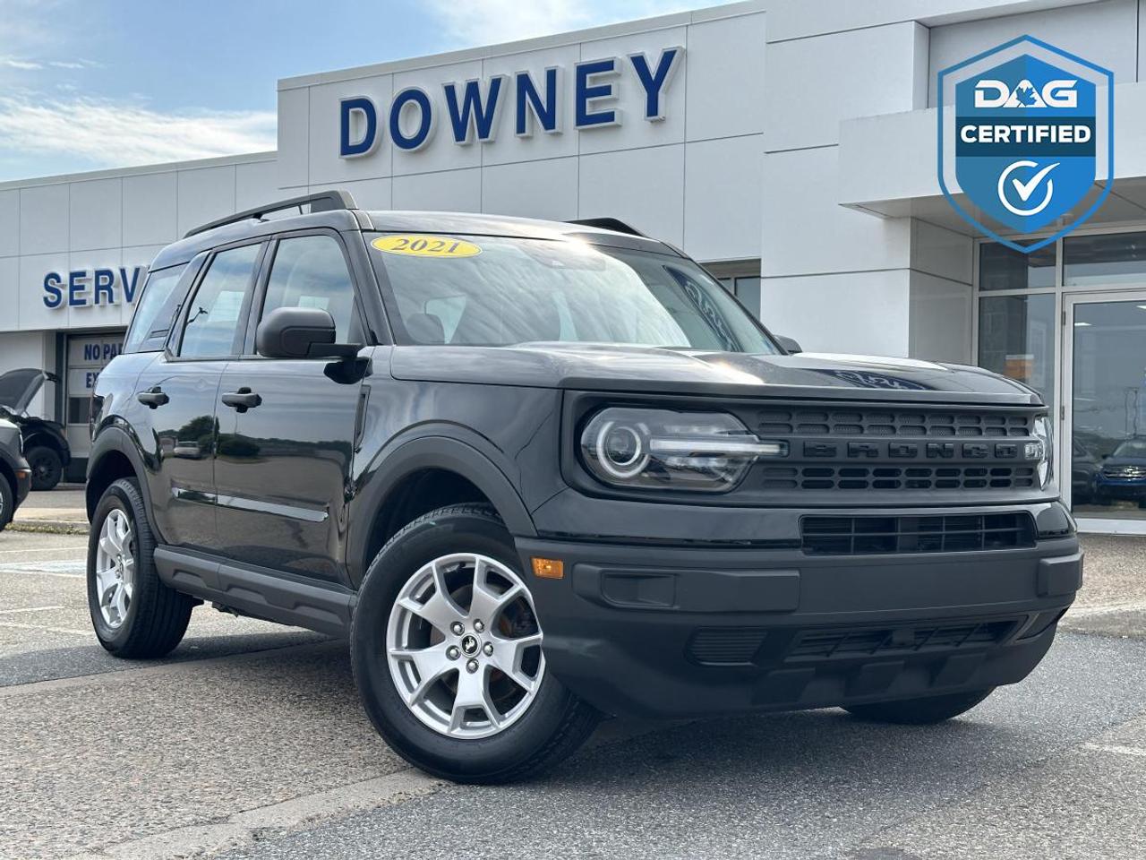 Finished in sleek Shadow Black with a matching Ebony Black interior, this 2021 Ford Bronco Sport Base is a compact SUV built for adventure while remaining perfectly suited to everyday life. Powered by an efficient and responsive 1.5L EcoBoost engine paired with an 8-speed automatic transmission, it delivers a confident driving experience with the versatility and capability that have quickly made the Bronco Sport a favourite among outdoor enthusiasts and commuters alike. Its rugged styling and unmistakable Bronco heritage ensure it stands out wherever the road takes you.

Inside, the Bronco Sport offers a thoughtfully designed cabin that balances practicality and comfort. The five-passenger seating configuration provides impressive space for both passengers and cargo, while the durable interior materials are designed to handle everything from daily errands to weekend escapes. With Equipment Group 100A, youll enjoy a straightforward, functional layout that puts essential controls and conveniences right where you need them.

Technology is seamlessly integrated throughout the cabin, helping keep you connected and informed on every journey. The intuitive infotainment system features smartphone compatibility and easy-to-use controls, allowing you to access your favourite apps, music, and navigation with ease. Large windows and excellent visibility contribute to an airy, confident driving experience, whether youre exploring new trails or navigating busy city streets.

Safety and confidence come standard with a suite of modern driver-assist features designed to support you on the road. Combined with its capable engineering, comfortable interior, and impressive versatility, this 2021 Ford Bronco Sport Base is ready for whatever your lifestyle demands. Tough, stylish, and adventure-ready, its the perfect SUV for drivers who want the freedom to go wherever inspiration leads.

Why buy from Downey Ford? GREAT QUESTION!! Heres why:  Market Value Pricing provides the most competitive prices on all our pre-owned vehicles, all the time!  Downey Ford is the largest volume Ford dealership in the Maritimes.  Every Pre-Owned Vehicle comes with New Wipers, New In-Cabin Filter , New Engine Air Filter,  Plus Plus Plus . Reconditioning our pre-owned inventory is a source of pride for us! A basic motor vehicle inspection and a quick wash just isnt good enough for our customers. We complete an extremely thorough process, both mechanically and cosmetically, before it meets our standards. Heres just some of what we do:  Mechanical inspection that covers 100 +++ components including:  Engine  Electrical System  Suspension  Transmission  Brakes  Frame  Regular maintenance servicing  Plus Plus Plus  Our cosmetic reconditioning is elite:  Shampooing of Carpet  Acid Wash of Rims  Dressing of Tires  Engine Detail  Multi-stage polish  Plus Plus Plus  Here are some other extras we are happy to offer at no charge to you:  Vehicle History Report  Accident / Damage Report  Stolen Vehicle Report  Lien Search Report  Credit Report Review and Counseling  Free Trade-In Appraisals  Relaxed Low Pressure Sales Experience  Finance Pre-Approval Service  Service  Departments covering ALL of Southern New Brunswick  Delivery Services to all of Canada  Multiple Chartered Bank Financing Sources  Multiple Vehicle Protection Products available  Multiple Loan Protection Products available  Pet-Friendly Facility - Feel free to bring Bingo with you.

We want to EARN your business and hope to speak with you soon.

Our knowledgeable and friendly sales staff are here to ensure a seamless and enjoyable car-buying experience. Call us at 506-632-6000 to book your test drive today and discover why Downey Ford is the trusted choice for so many.