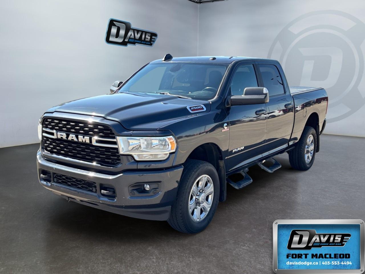 <p>Presenting the 2022 Ram 2500 Big Horn 4x4 Crew Cab, a powerful truck in an elegant gray finish. Its robust 4x4 drivetrain and precise handling make it a top choice for those who need reliability along with performance.</p><p><strong>Exterior Features:</strong></p><ul><li>Gray paint on a bold truck frame that exudes strength and sophistication</li><li>Heavy-duty engine cooling and supplemental heater for optimal performance in varying conditions</li><li>Tow hooks and winter front grille cover, emphasizing its readiness for tough environments</li><li>Front bumper sight shields and diesel exhaust brake for enhanced safety and control</li></ul><p><strong>Interior Features:</strong></p><ul><li>Spacious cabin with black interior furnishings</li><li>Comfort-oriented features like air conditioning and keyless entry</li><li>Convenient power windows and heated mirrors for ease of use and visibility</li><li>Satellite radio and cruise control ensuring a pleasant driving experience</li></ul><p><strong>Technology & Safety Features:</strong></p><ul><li>Advanced engine options like the 6.7L Cummins I-6 Turbo Diesel with selective catalytic reduction</li><li>Connectivity features including a Bluetooth connection, smart device integration, and a Wi-Fi hotspot</li><li>Safety-focused elements such as a backup camera and brake assist</li><li>Innovative diesel technology providing robust power at 370 RPM</li></ul><p>Ideal for drivers seeking a blend of serious capability and modern amenities, this Ram 2500 Big Horn provides the strength and intelligence you need for work and leisure alike. Contact Davis Dodge Fort Macleod today for more details and take it for a spin.</p>