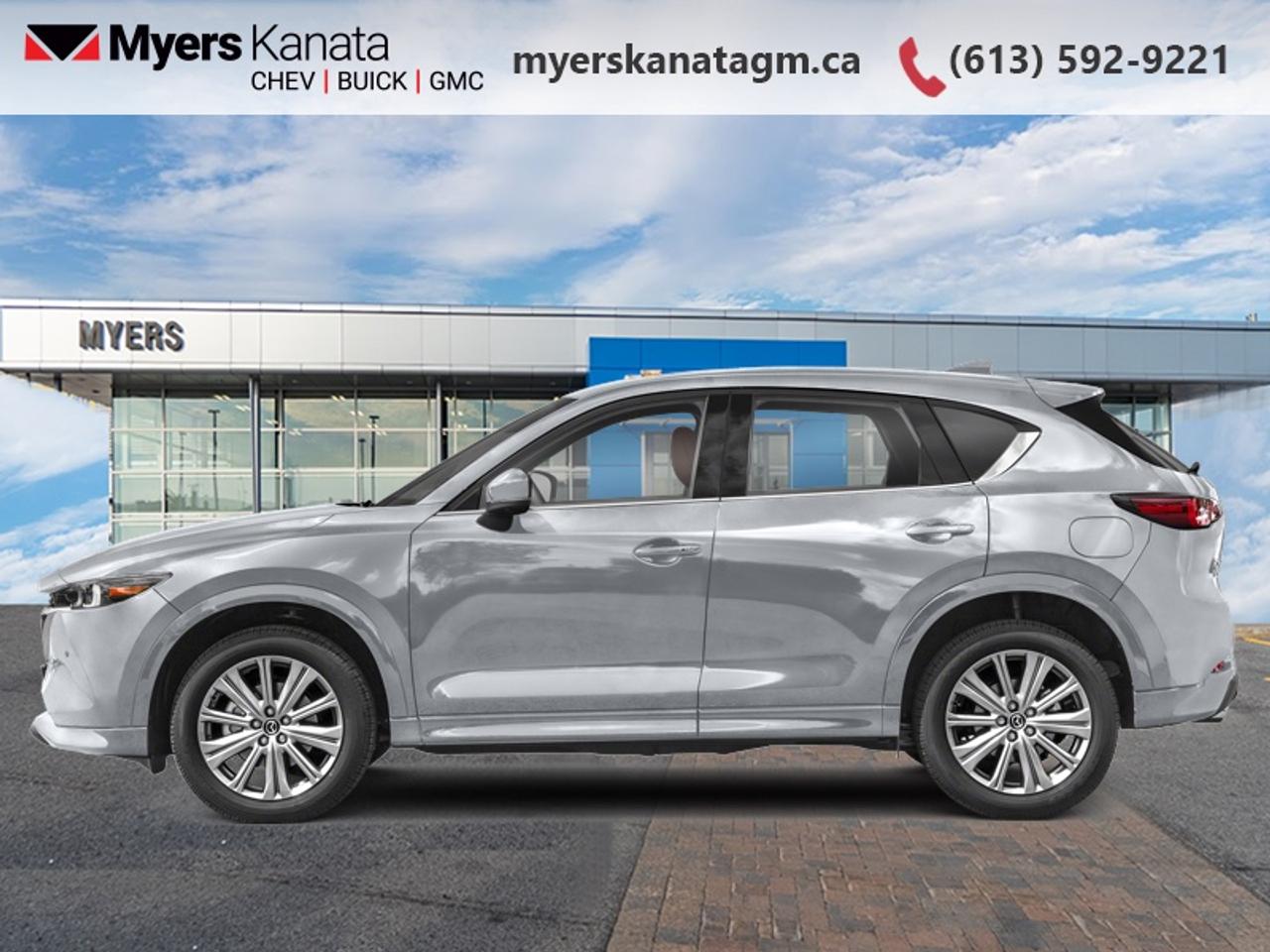 <b>Low Mileage, Heads Up Display,  Cooled Seats,  Leather Seats,  Sunroof,  Navigation!</b><br> <br> This 2022 Mazda CX-5 is for sale today in Kanata.<br> <br>The 2022 CX-5 strengthens the connection between vehicle and driver. Mazda designers and engineers carefully consider every element of the vehicles makeup to ensure that the CX-5 outperforms expectations and elevates the experience of driving. Powerful and precise, yet comfortable and connected, the 2022 CX-5 is purposefully designed for drivers, no matter what the conditions might be.<br> <br>This low mileage SUV has just 9,391 km. Its Sonic Silver Metallic in colour and is completely accident free based on the <a href=https://vhr.carfax.ca/?id=Oyzm9FHZaWLNedB0UFlY1iWCF1ApFfTi target=_blank>CARFAX Report</a>. It has an Automatic transmission and is powered by a smooth engine. <br> <br> Our CX-5s trim level is Signature. This Signature CX-5 takes luxury to new levels with nappa leather upholstery, wood trim, a 360 parking camera, collision assist, and parking sensors. A sunroof above heated and cooled leather seats offers incredible comfort, while the heads up display shows you ultra modern technology. Listen to your favorite tunes through your navigation equipped infotainment system complete with Bose Premium Audio, Android Auto, Apple CarPlay, and many more connectivity features. A power liftgate offers convenience and lane keep assist, blind spot monitoring, and distance pacing cruise with stop and go helps you stay safe. This vehicle has been upgraded with the following features: Heads Up Display, Cooled Seats, Leather Seats, Sunroof, Navigation, Premium Audio, Power Liftgate.<br> <br>To apply right now for financing use this link: <a href=https://www.myerskanatagm.ca/finance/ target=_blank>https://www.myerskanatagm.ca/finance/</a><br> <br/><br>Price is plus HST and licence only.<br> Book a test drive today at myerskanatagm.ca<br>*LIFETIME ENGINE TRANSMISSION WARRANTY NOT AVAILABLE ON VEHICLES WITH KMS EXCEEDING 140,000KM, VEHICLES 8 YEARS & OLDER, OR HIGHLINE BRAND VEHICLE(eg. BMW, INFINITI. CADILLAC, LEXUS...)<br> Come by and check out our fleet of 40+ used cars and trucks and 220+ new cars and trucks for sale in Kanata.  o~o