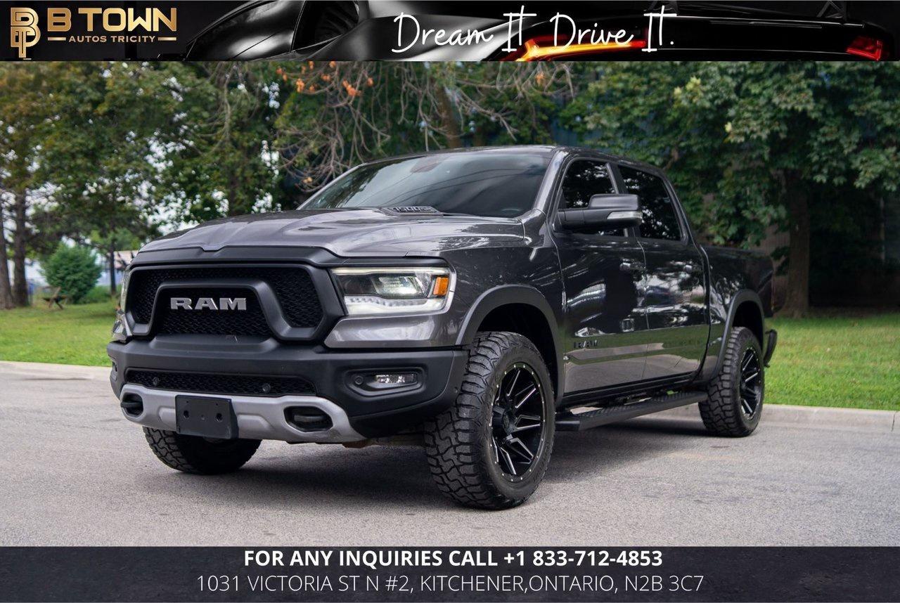 <span>Finished in </span><span>Grey</span><span>, this </span><strong>2019 Ram 1500 Rebel</strong><span><strong> combines rugged off-road capability, bold styling, and everyday comfort.</strong> Designed for drivers who want a truck that performs as well on trails as it does on the highway, the Rebel stands out with its aggressive appearance, upgraded suspension, and impressive towing capability.</span>




<span>Powered by a </span><strong>5.7L HEMI V8 engine producing 395 horsepower and 410 lb-ft of torque, paired with an 8-Speed Automatic Transmission and 4x4 Four-Wheel Drive</strong><span><strong>,</strong> this </span><span>Ram 1500 Rebel</span><span> delivers strong performance, confident handling, and exceptional versatility. With </span><span>119,700 KM</span><span>, this well-equipped pickup is ready for work, adventure, and everything in between.</span>




<strong>Factory Options & Features:</strong><span>

&bull; </span><span>5.7L HEMI V8 &ndash; 395 HP</span><span>

&bull; 8-Speed Automatic Transmission

&bull; 4x4 Four-Wheel Drive

&bull; Rebel Off-Road Package

&bull; Performance-Tuned Suspension

&bull; Electronic Locking Rear Differential

&bull; Heated Front Seats

&bull; Heated Steering Wheel

&bull; Uconnect Touchscreen Infotainment System

&bull; Apple CarPlay & Android Auto

&bull; Remote Start System

&bull; Rear View Camera

&bull; ParkSense Front & Rear Park Assist

&bull; Dual-Zone Automatic Climate Control

&bull; Premium Alloy Wheels

&bull; Tow Package</span>







<strong>At B-Town Auto Tricity, each vehicle undergoes a comprehensive inspection to ensure exceptional quality and performance. We proudly serve customers across the Greater Toronto Area and beyond, offering competitive financing, trade-ins, and nationwide shipping.</strong>




<strong>$999* FINANCING FEES APPLY.</strong>




<strong>Special Financing price: $36,888</strong>

<strong>Cash Price: $38,388</strong>




<strong>Thank you for choosing B-Town Auto Tricity.</strong>