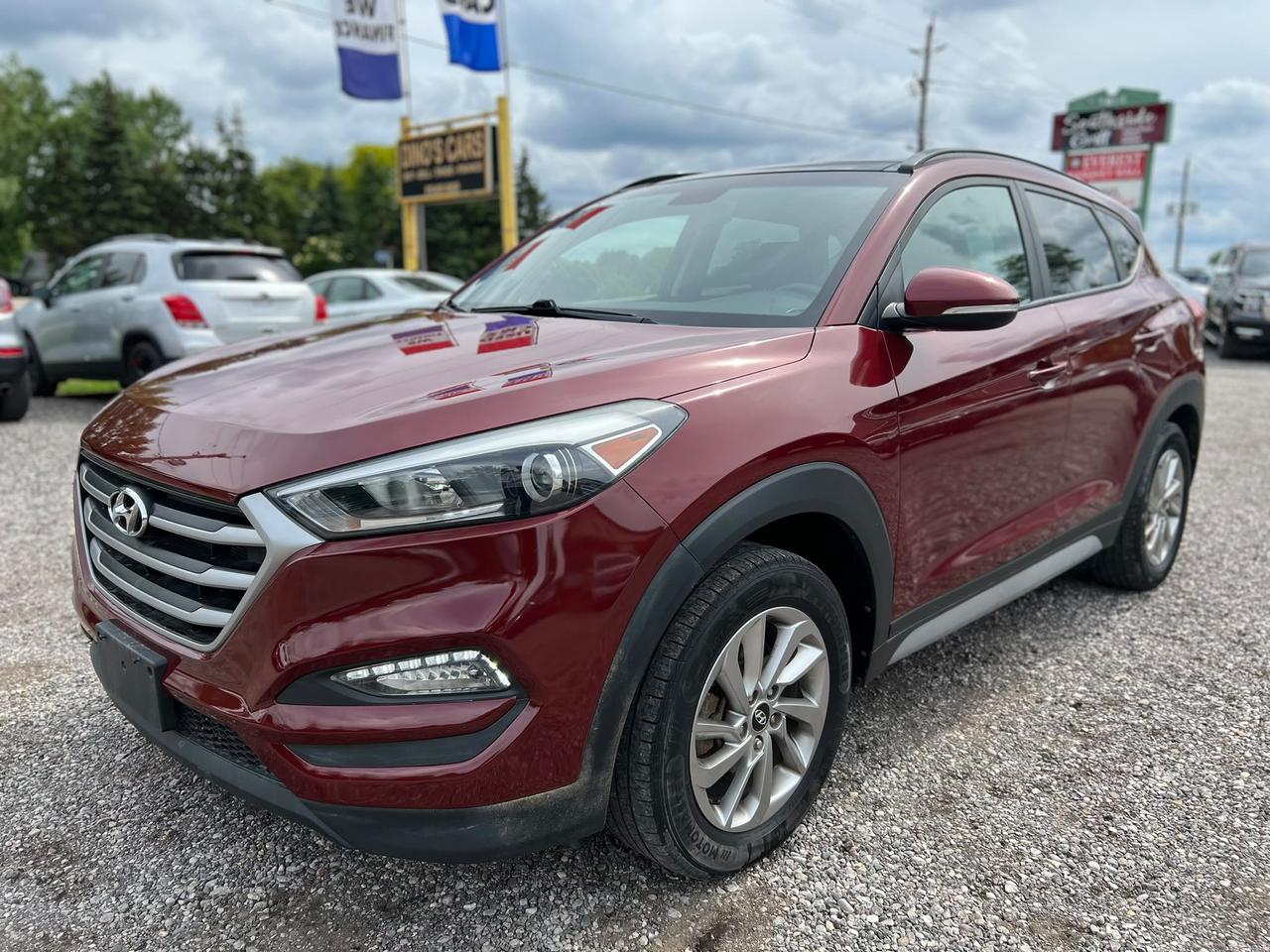 <p>CERTIFIED,</p><p>We finance</p><p>Contact us for pre approval,</p><p>DINOS CARS</p><p>-Safety certification included in the price ( UNLESS SPECIFIED OTHERWISE ie. AS IS VEHICLES)</p><p>-IF YOU CANT COME TO US WELL DRIVE TO YOU ( WITHIN A REASONABLE DISTANCE TO VIEW) DELIVERY ALSO AVAILABLE</p><p>-Certified Quality Pre owned Vehicles</p><p>-Carfax history report available for every vehicle</p><p>-Licensing and tax are extra</p><p>-Open by Appointment Call or text(519)697-3866</p><p>-4016 Dundas St E, London, ON N5V 5C6</p><p>Looking for a reliable and stylish SUV thats ready for all your adventures, no matter the season? Dinos Cars has the perfect match for you: a certified pre-owned 2018 Hyundai Tucson 2.0L SE AWD. This stunning burgundy beauty boasts a sleek exterior and a comfortable black interior, offering a sophisticated look and feel. Whether youre navigating city streets or heading out for a weekend getaway, this Tucson is designed to impress and perform.</p><p>With just 130,441 kilometers on the odometer, this 2018 Hyundai Tucson 2.0L SE AWD has plenty of life left to offer. Its equipped with an automatic transmission and a fuel-efficient gasoline engine, making every drive smooth and economical. The versatile SUV/Crossover body style provides ample space for passengers and cargo, while the four-door configuration ensures easy access for everyone. Plus, with All-Wheel Drive, you can have the confidence to tackle Canadian roads in any condition.</p><p>Here are 5 sizzling features of this 2018 Hyundai Tucson 2.0L SE AWD:</p><ul><li><strong>Certified Pre-Owned Peace of Mind:</strong> Drive with confidence knowing this Tucson has passed a rigorous inspection and meets Dinos Cars high standards for quality and reliability.</li><li><strong>All-Wheel Drive Capability:</strong> Conquer Canadian winters and unpredictable terrain with the sure-footed performance of its advanced All-Wheel Drive system.</li><li><strong>Spacious SUV/Crossover Design:</strong> Enjoy the perfect blend of maneuverability and cargo room, ideal for everything from daily commutes to family road trips.</li><li><strong>Smooth Automatic Transmission:</strong> Experience effortless driving and seamless gear changes for a more relaxed and enjoyable journey.</li><li><strong>Stylish Burgundy Exterior:</strong> Turn heads with the sophisticated and eye-catching burgundy paint, making this Tucson stand out from the crowd.</li></ul><p><strong><em>Powered by AutoIntelligence&trade;</em></strong></p><p>Vehicle information has been generated using artificial intelligence and is provided for informational purposes only. While efforts are made to ensure accuracy, please confirm all details directly with the dealer.</p>