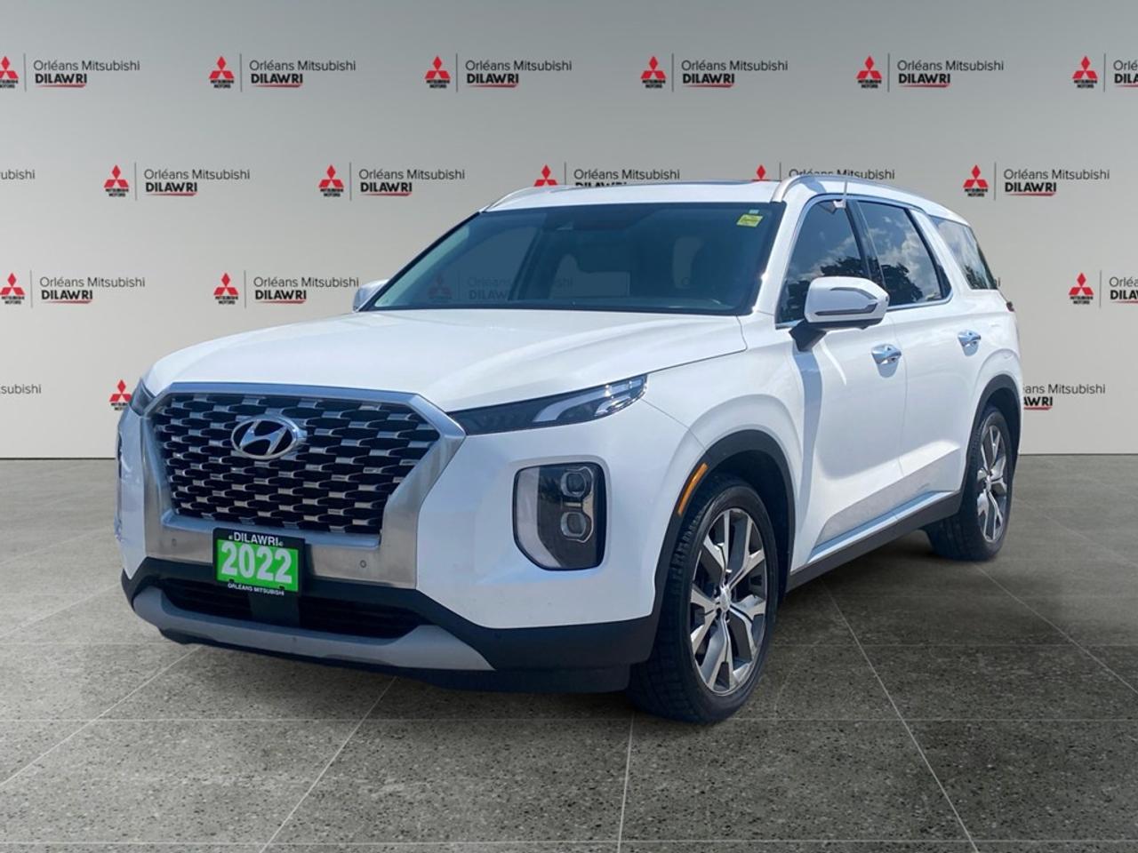 Experience the impeccable blend of luxury and performance with the 2022 Hyundai Palisade Luxury 7-Passenger AWD, in a refined white finish. This all-wheel-drive SUV promises exceptional handling across a variety of terrains, making every journey comfortable and smooth. The exterior of this Palisade turns heads with its striking presence, accentuated by stylish alloy wheels and the functional elegance of heated mirrors. As you step inside, indulge in the luxurious interior with leather seats that provide both heated and cooled front seating options, ensuring comfort in every season. With a spacious third row, this SUV is perfectly equipped to accommodate your family or friends. The technology suite of the Palisade excels with features designed for convenience and safety. Stay connected effortlessly with Bluetooth connection and a navigational system that keeps you on the right path. The smart device integration, satellite radio, and outstanding sound system cater to your entertainment needs. Safety is paramount with modern features like a backup camera, parking sensors, lane assist, and adaptive cruise control, giving you peace of mind on every drive. Perfectly suited for families seeking a sophisticated ride or adventurers needing space for gear, the 2022 Hyundai Palisade Luxury 7-Passenger AWD is ready for your next venture. Contact Orleans Mitsubishi today to explore this exceptional vehicle and schedule a test drive.