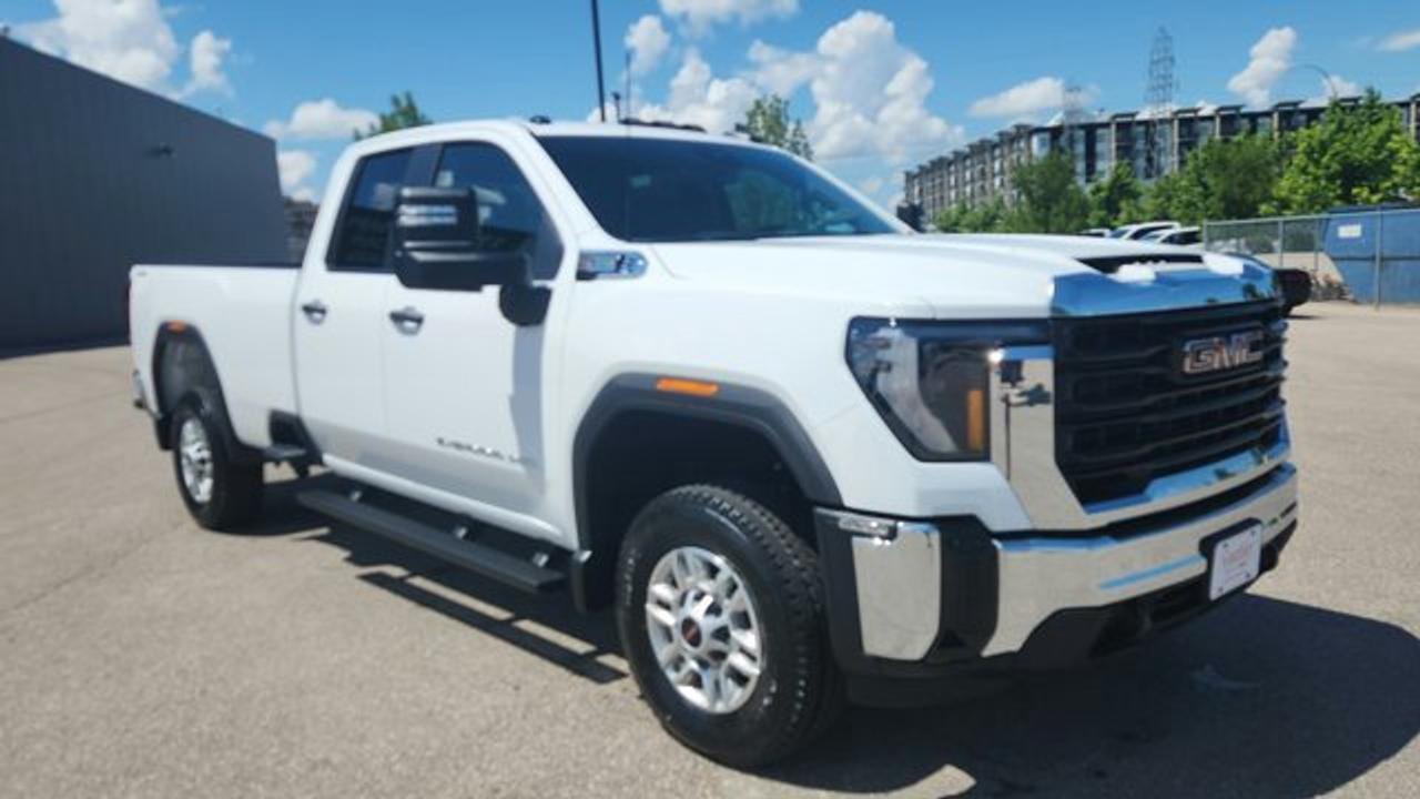 At the heart of this Sierra 2500HD lies a powerful 6.6L V8 gas engine, delivering 401 horsepower and 464 lb-ft of torque. Paired with a smooth-shifting 10-speed automatic transmission and a robust 4-wheel drive system, this truck is designed to provide consistent, reliable performance whether you are hauling heavy equipment or navigating difficult terrain. The fully boxed frame and integrated trailer brake controller ensure you have the confidence needed for serious towing.<br />Inside, the cabin is designed for functionality and long-term durability. It features easy-to-clean vinyl seating and rubberized-vinyl floor covering, making it an excellent choice for work environments. The driver-focused interior includes a user-friendly infotainment system with a 7-inch touchscreen, supporting wireless Apple CarPlay and Android Auto. This setup keeps you connected to your navigation, music, and communications without the clutter of extra cords.