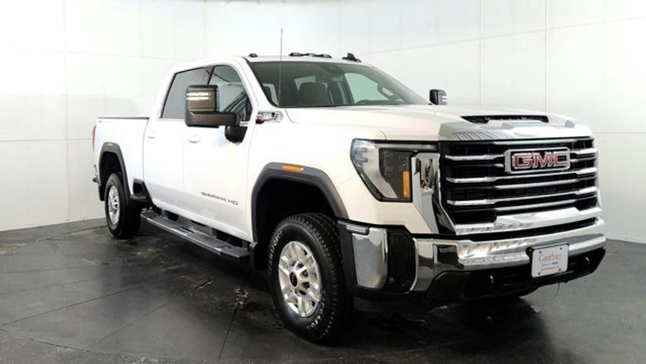 The 2026 GMC Sierra 2500HD SLE is a well-equipped heavy-duty pickup that balances work-ready capability with upgraded comfort and technology, featuring a bold exterior design, multiple cab and bed configurations, and a more refined interior than the base trim. It comes standard with a large 13.4-inch infotainment touchscreen, a 12.3-inch digital driver display, keyless entry with push-button start, and features like a Bose audio system, advanced trailering tech, the MultiPro tailgate and the X31 offroad package. Powered by a Duramax 6.6-liter turbo-diesel, it delivers strong towing performance along with essential safety features such as automatic emergency braking and lane-departure warning.