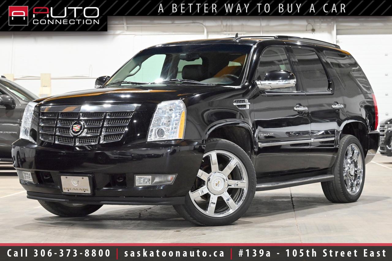 <p><font color=#000000><span></span><span>Excellent Condition! - Regularly Maintained - Lots of Features!</span><span><br></span></font><span><br></span><span>Key Features:</span><span><br></span><span><br>- All-Wheel Drive (AWD)<br>- 7-Passenger Seating<br>- Cooled & Heated Front Seats<br>- Heated 2nd-Row Seats<br>- Heated Steering Wheel<br>- Adaptive Remote Start<br>- Rear-Seat Entertainment System (Dual 7-Inch DVD Screens)<br>- Navigation w/ Voice Recognition<br>- Power Moonroof<br>- 10-Speaker Bose Premium Surround Sound System<br>- Ultrasonic Rear Park Assist<br>- Rearview Camera<br>- Side Blind Zone Alert<br>- IntelliBeam Auto High Beams<br>- Power Liftgate<br>- Tri-Zone Automatic Climate Control<br>- 8-Inch Touchscreen Display<br>- Bluetooth Hands-Free Calling<br>- Universal Home Remote<br>- 14-Way Power Front Seats w/ Drivers Memory<br>- Power-Release Fold & Tumble 2nd-Row Seat<br>- Power-Adjustable Pedals w/ Memory<br>- Power-Folding Heated Exterior Mirrors<br>- Xenon HID Headlamps<br>- Heavy-Duty Trailering Package<br>- 8,100lb. Towing Capacity<br>- 3.42 Rear Axle Ratio<br>- Magnetic Ride Control<br>- 6-Speed Heavy-Duty Automatic Transmission<br>- 6.2L Vortec 8-Cylinder Engine<br><br><b>Exterior Colour:</b> Black Raven<br><b>Interior Colour:</b> Ebony Leather<br><br><b>Manufacturers Brochure:</b> </span><a href=https://autocatalogarchive.com/wp-content/uploads/2016/05/Cadillac-Escalade-2011.pdf?__cf_chl_f_tk=LqcplKS3LfHkn_7cnlASKGGpgSSUrrTqjiLIlMfSzZo-1782751244-1.0.1.1-QXbY9ABNgN3T9o.pQsxOZW9XJj_bDR6058wz4yldvr8 target=_blank><span>https://autocatalogarchive.com/wp-content/uploads/2016/05/Cadillac-Escalade-2011.pdf?__cf_chl_f_tk=LqcplKS3LfHkn_7cnlASKGGpgSSUrrTqjiLIlMfSzZo-1782751244-1.0.1.1-QXbY9ABNgN3T9o.pQsxOZW9XJj_bDR6058wz4yldvr8</span></a><span><br><br></span><span><span>Unlock a full year of exclusive VIP benefits with your purchase! Enjoy 20% off labour, 25% off tires, free windshield stone chip repairs, and so much more. Visit saskatoonauto.ca for all the details.</span><br></span><span><br>Honesty Pricing eliminates the haggle hassle by providing you with our lowest possible selling price up front. In fact, it is the lowest price in our market, and we will prove it by disclosing a comprehensive market report of what our competitors are selling similar vehicles for.<br></span><span><br>This vehicle meets our Diamond Certification standard, which begins by selecting only premium quality vehicles and subjecting them to a much more comprehensive inspection process than typical dealerships use. Diamond Certified ensures a clean history, exceptional appearance and problem-free operation.<br></span><span><br>At Saskatoon Auto Connection we sell pre-owned automobiles the way we would like to buy them ourselves. Since 2008, we have been dedicated to providing the highest level of integrity and transparency in our industry, in combination with the highest quality vehicles at the most competitive prices in Saskatchewan. Our friendly staff is ready to positively redefine your expectations of the pre-owned automobile space.</span><span></span></p>