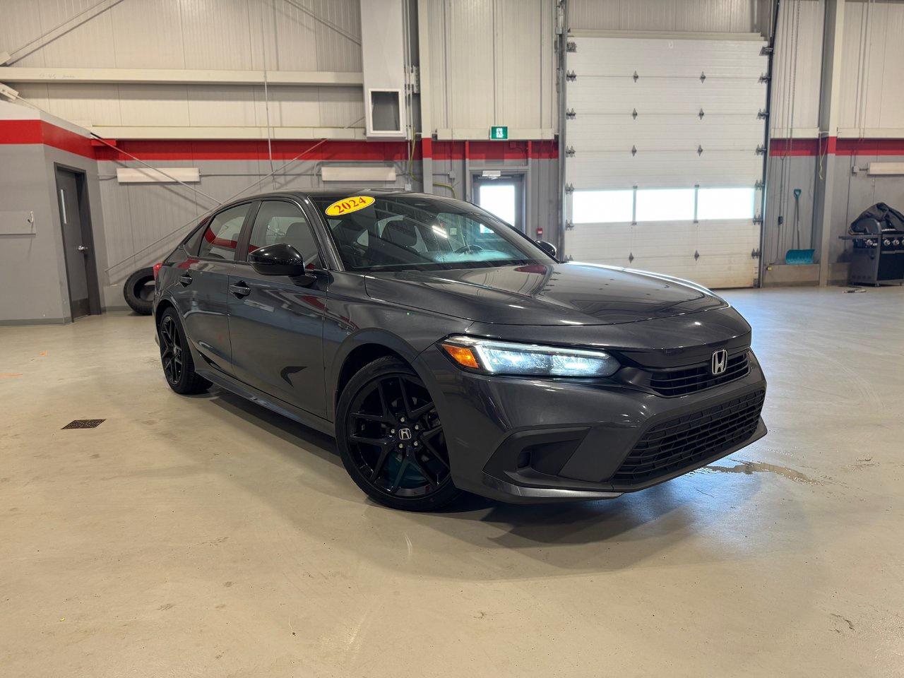 <span>The Honda Civic is part of Canadas automotive heritage. The first Civic arrived in Canada nearly five decades ago. Its been built in Canada for nearly 40 years. Its been Canadas best-selling car over the last quarter-century. You cant separate Canadas vehicular landscape from the Honda Civic.</span>




<span>The Civic is a legend, yet this 2024 Honda Civic is also a class-leading, award-winning, critically acclaimed, modern and high-tech sports sedan. </span>




<span>This 2024 Honda Civic Sport is a perfect symbol of what makes the 11th-generation Civic so great, exemplified by upmarket content like a sunroof, rain-sensing wipers, dual-zone automatic climate control, and proximity access/pushbutton start. There are also heated front seats, a heated steering wheel, &nbsp;auto high beams, blind spot monitoring, and Honda Sensing (adaptive cruise, lane keeping assist, etc.), and a 7-inch centre screen with Apple CarPlay/Android Auto. Key upgrades in the Civic Sport include 18-inch alloys, unique exterior treatments, and leather-bolstered seats.</span>




<span style=font-weight: 400;>Thank you for your interest in this vehicle. Its located at Centennial Honda, 515 Central Street, Summerside, PEI. We look forward to hearing from you; call us at 1-902-436-9158.</span>