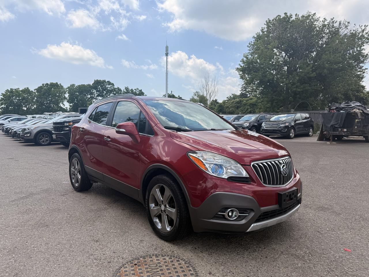 <p>Discover the perfect blend of style and practicality with this stunning burgundy 2014 Buick Encore Convenience, now available at Target Auto Centre. This well-maintained SUV crossover is ready for its next adventure, offering a comfortable and versatile driving experience for your daily commute or weekend getaways. Step inside and appreciate the sophisticated black interior, a perfect complement to the rich exterior hue, creating an inviting and premium cabin atmosphere. Powered by a fuel-efficient 1.4L I4 engine paired with an smooth automatic transmission and front-wheel drive, this Buick Encore delivers a nimble and responsive ride. With four doors and ample cargo space, its designed to accommodate your lifestyle with ease. This meticulously cared-for 2014 Buick Encore Convenience, with 143,811 km on the odometer, is a fantastic option for anyone seeking a reliable and stylish compact SUV. Its been thoughtfully maintained, ensuring you can drive away with confidence. Whether youre navigating city streets or exploring scenic routes, the Encore offers a refined and enjoyable journey. Visit Target Auto Centre to see firsthand why this burgundy beauty is such a standout.</p><p>&nbsp;</p><hr><p>&nbsp;</p><p dir=ltr><strong>CERTIFIED PRE-OWNED VEHICLE | BUY WITH CONFIDENCE</strong></p><p dir=ltr>&nbsp;- Ontario Safety Standards Certificate Included<br>- 30 Day / 1,000 KM Safety Warranty Included<br>- Fully Detailed Prior to Delivery<br>- CARFAX Vehicle History Report Available<br>&nbsp; (View on Our Website)</p><p>&nbsp;</p><hr><p>&nbsp;</p><p dir=ltr><strong>VALUE AND TRANSPARENCY | WHY CHOOSE US</strong></p><p dir=ltr>- Price Plus HST & Licensing Only<br>- No Additional Fees | All-In Pricing<br>- Same Price Cash or Finance<br>- Extended Warranty Protection Plans Available<br>- Autotrader Best Priced Dealer Award (2024)<br>- Competitive Market Value on Trade-ins<br>- We&rsquo;ll Buy Your Car &mdash; No Purchase Required<br>- Know Someone Looking For a Vehicle? Get a Referral Award<br>- Open 7 Days a Week</p><p>&nbsp;</p><hr><p>&nbsp;</p><p dir=ltr><strong>ABOUT TARGET AUTO CENTRE</strong></p><p dir=ltr>Target Auto Centre has been proudly serving London, Ontario and surrounding areas for over 20 years, offering over 150 quality pre-owned vehicles and a constantly updated selection to choose from. We focus on providing competitive pricing, clear information, and a straightforward buying process so you know exactly what to expect from start to finish.</p><p dir=ltr>Cars For Everyone! We offer a wide selection of vehicles to fit every lifestyle, need, and budget. Our inventory includes cars, trucks, SUVs, and vans from trusted brands such as Ford, Chevrolet, Toyota, Honda, Nissan, BMW, Mercedes-Benz, Audi, Lexus, Acura, Hyundai, Kia, Mazda, Volkswagen, Jeep, RAM, GMC, Subaru, and more. With new arrivals regularly, there&rsquo;s always something for everyone.</p><p dir=ltr>As a proud member of the Used Car Dealers Association of Ontario (UCDA), we are committed to operating with honesty, transparency, and professionalism in every transaction. Our goal is to make your vehicle purchase as simple and stress-free as possible, while delivering the level of service our customers continue to trust. Come visit us today and see why were the preferred choice for pre-owned vehicles in London and the surrounding areas. We look forward to earning your business!</p>