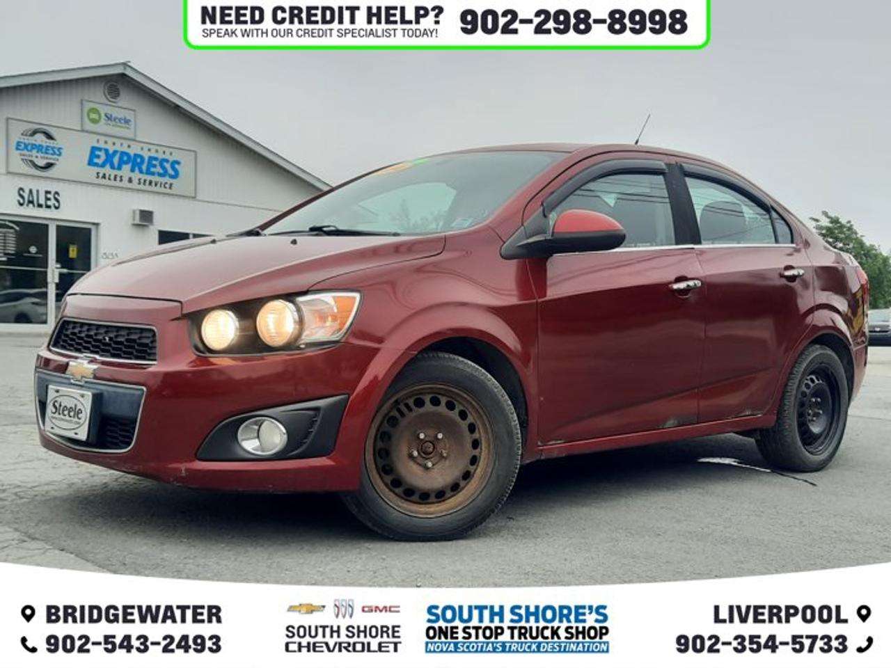 Recent Arrival! Red 2014 Chevrolet Sonic LT For Sale, Bridgewater FWD 6-Speed Automatic ECOTEC 1.8L I4 SMPI DOHC VVT 6 Speakers, ABS brakes, Air Conditioning, CD player, Compass, Delay-off headlights, Driver door bin, Driver vanity mirror, Electronic Stability Control, Emergency communication system: OnStar Directions & Connections, Front anti-roll bar, Fully automatic headlights, Heated door mirrors, Heated Front Reclining Bucket Seats, Heated front seats, Illuminated entry, Occupant sensing airbag, Outside temperature display, Panic alarm, Passenger door bin, Power door mirrors, Power steering, Power windows, Rear window defroster, Remote keyless entry, Security system, Speed control, Tachometer, Telescoping steering wheel, Tilt steering wheel, Variably intermittent wipers.