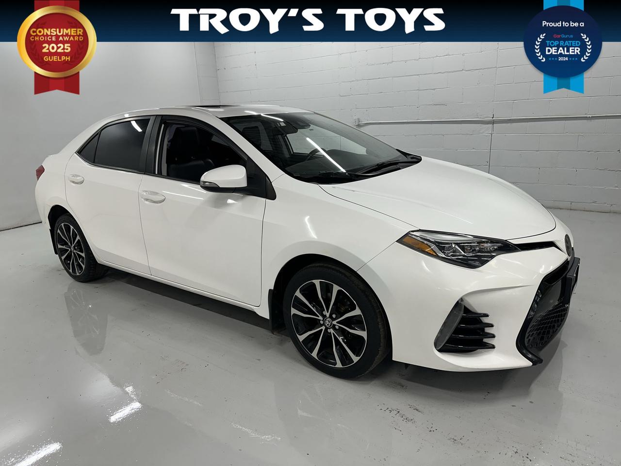 <p>Looking for a reliable and stylish ride that wont break the bank? Troys Toys has a fantastic 2017 Toyota Corolla SE thats ready to hit the road with you! This sporty sedan boasts a sleek white exterior thats sure to turn heads, perfectly complemented by a comfortable black interior. Its powered by an efficient 1.8L I4 engine paired with a smooth Variable/CVT transmission, offering a responsive and enjoyable driving experience. With its practical four-door design and front-wheel drive, this Corolla is ideal for everything from daily commutes to weekend adventures. Its currently showing 175,465 kilometers on the odometer, a testament to its proven durability.</p><p>This 2017 Toyota Corolla SE is more than just a car; its a smart investment in your daily life. Youll appreciate the fuel efficiency and the legendary reliability that Toyota is known for, making this a worry-free choice for the long haul. Whether youre navigating city streets or cruising on the highway, youll feel confident and in control.</p><p>Here are 5 sizzling features that make this 2017 Toyota Corolla SE stand out at Troys Toys:</p><ul><li><strong>Sporty SE Trim:</strong> Elevate your driving experience with the SE trim, designed for a more dynamic feel and sharper aesthetics.</li><li><strong>Fuel-Efficient 1.8L I4 Engine:</strong> Enjoy impressive gas mileage that keeps your wallet happy mile after mile.</li><li><strong>Smooth Variable Transmission (CVT):</strong> Experience seamless acceleration and an incredibly fluid ride.</li><li><strong>Sleek White Exterior:</strong> Make a statement with a timeless and eye-catching white finish.</li><li><strong>Comfortable Black Interior:</strong> Settle into a refined and practical cabin designed for everyday comfort.</li></ul><p><strong><em>Powered by AutoIntelligence&trade;</em></strong></p><p>Vehicle information has been generated using artificial intelligence and is provided for informational purposes only. While efforts are made to ensure accuracy, please confirm all details directly with the dealer.</p>