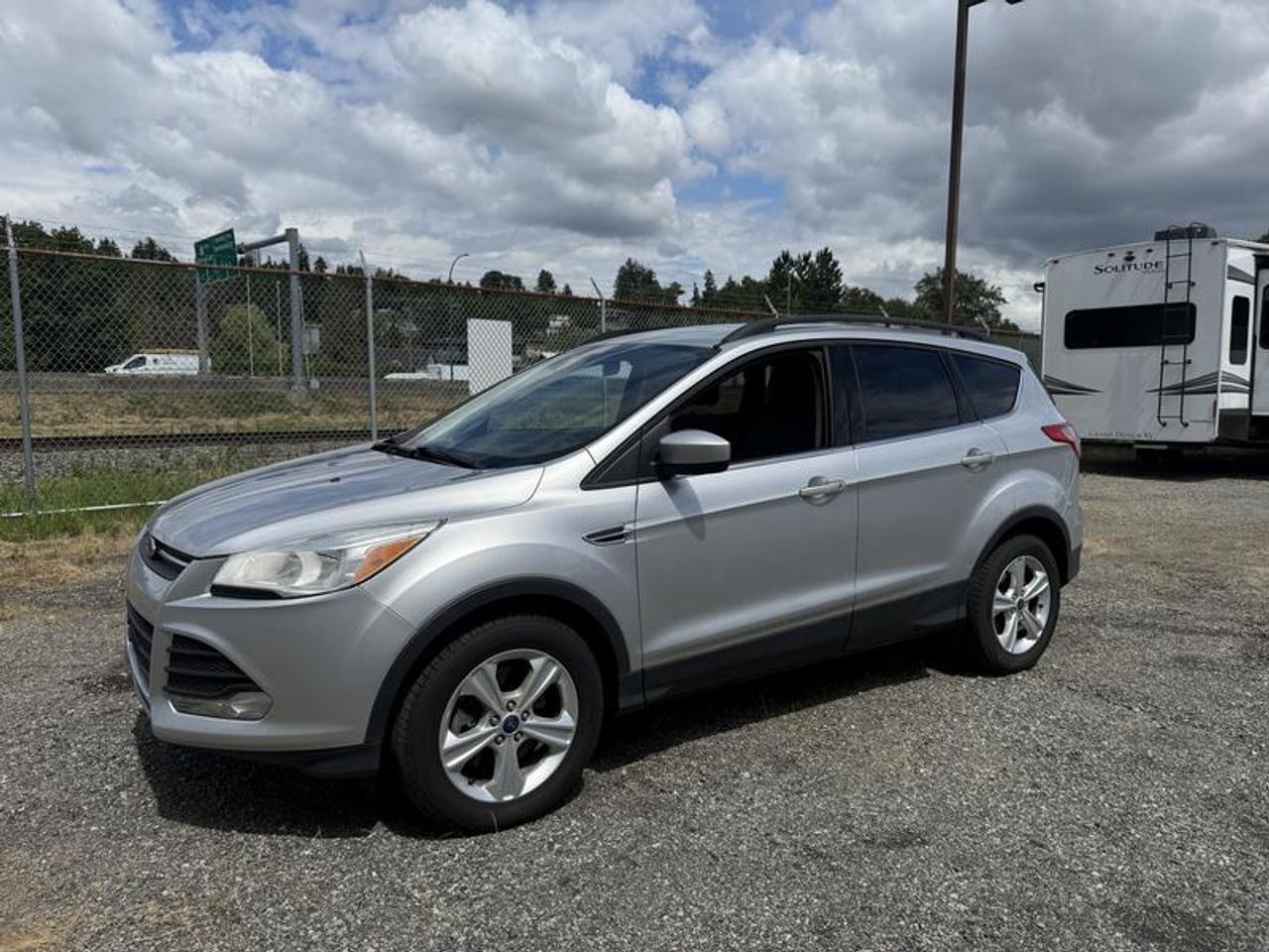 2015 Ford Escape SE 4WD, 1.6L L4 DOHC 16V, 4 cylinder, 4 door, automatic, 4WD, 4-Wheel ABS, cruise control, AM/FM radio, power door locks, power windows, silver exterior, black interior, cloth. This listing is a former government asset  $10,560.00 plus $375 processing fee, $10,935.00 total payment obligation before taxes.   Listing report, warranty, contract commitment cancellation fee, financing available on approved credit (some limitations and exceptions may apply). All above specifications and information is considered to be accurate but is not guaranteed and no opinion or advice is given as to whether this item should be purchased. We do not allow test drives due to theft, fraud, acts of vandalism and undetectable impaired driving. Instead we provide the following benefits: Complimentary Warranty (with options to extend), Limited Money Back Satisfaction Guarantee on Fully Completed Contracts, Contract Commitment Cancellation, and an Open-Ended Sell-Back Option. Ask seller for details or call 604-522-REPO(7376) to confirm listing availability.