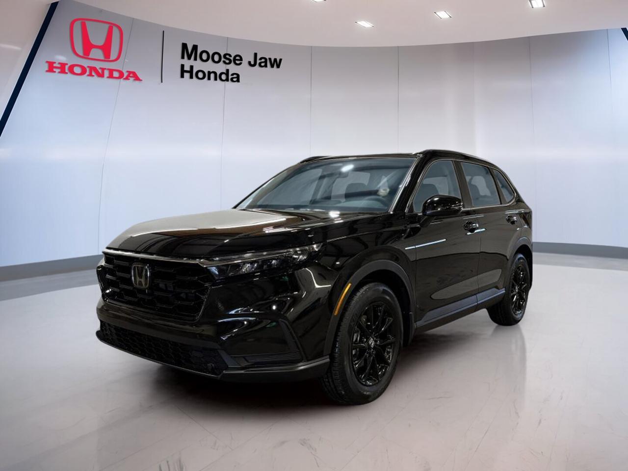 Meet the brand new 2026 Honda CR-V Sport, now at Moose Jaw Honda in Moose Jaw. This compact SUV blends everyday comfort, confident all-wheel-drive traction, and turbocharged power in a smart, modern package. Finished in Black with a Black interior, it delivers clean style and practical value for drivers who want versatility year-round.

The 2026 Honda CR-V Sport is built to handle busy commutes, family errands, and weekend escapes with ease. Its Continuously Variable Transmission helps keep driving smooth, while the 1.5-litre 16-valve DOHC turbocharged 4-cylinder engine gives responsive performance. With all-wheel drive, this new Honda SUV is ready for changing prairie weather.

FEATURES OF THE CR-V Sport

»» Black exterior with sporty visual appeal
»» Standard all-wheel drive for added confidence
»» Turbocharged engine with smooth CVT response
»» Spacious cabin with practical everyday versatility

ADVANCED SAFETY FEATURES

»» Advanced airbag system for occupant protection
»» Vehicle Stability Assist helps maintain control
»» Anti-lock braking system supports steady stops
»» Tire Pressure Monitoring System adds awareness

PERFORMANCE AND EFFICIENCY

»» 1.5-litre turbocharged four-cylinder engine power
»» Continuously Variable Transmission for smooth acceleration
»» All-wheel drive for four-season traction
»» Balanced power for city and highway

COMFORT AND CONVENIENCE

»» Spacious cabin for daily driving comfort
»» Four-door access makes entry and exit easy
»» Well-designed layout supports driver focus
»» Practical seating for passengers and cargo

TECHNOLOGY AND CONNECTIVITY

»» Clear driver information display for essentials
»» Easy-to-reach controls improve daily usability
»» Modern cabin layout feels simple and smart
»» Convenient connectivity features support everyday driving

CARGO SPACE

»» Flexible rear cargo area for gear
»» Roomy design supports errands and travel
»» Rear seat versatility expands carrying options
»» Wide opening helps loading larger items

WHAT OTHER OWNERS LIKE

»» Comfortable ride in daily driving conditions
»» Useful cargo room for active lifestyles
»» Confident all-wheel drive in poor weather
»» Efficient turbo power for everyday use

The 2026 Honda CR-V Sport stands out with the right mix of utility and refinement. Its black-on-black colour combination gives it a clean, athletic look, while the elevated ride height and SUV design make it easy to live with in every season. For drivers in Saskatchewan, all-wheel drive adds welcome confidence on wet, snowy, or uneven roads.

Inside, the 2026 Honda CR-V Sport focuses on function and comfort. The cabin is designed for simple use, with a practical layout that keeps key controls close at hand. Passenger space is generous for a compact SUV, and the cargo area is ready for groceries, sports gear, luggage, and more.

Under the hood, the 2026 Honda CR-V Sport uses a 1.5-litre turbocharged engine that delivers solid everyday performance. Paired with a Continuously Variable Transmission, it offers smooth power delivery and efficient operation. This setup suits drivers who want easy acceleration, quiet cruising, and dependable response in both city and highway conditions.

As a brand new SUV at Moose Jaw Honda, the 2026 Honda CR-V Sport is an excellent choice for drivers who want modern Honda engineering, year-round traction, and practical versatility in one well-rounded package. It is ready to support work, family life, and weekend travel with comfort and confidence.

This 2026 Honda CR-V Sports VIN is: 2HKRS4H58TH116661.