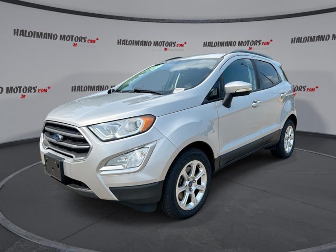 // ACCIDENT FREE!! //<br /><br />This 2018 Ford EcoSport SE FWD | No Accidents | Sunroof is a smart fit for daily driving in Cayuga and beyond. It blends easy handling, great comfort, and useful tech in a compact SUV shape. The silver exterior and black interior give it a clean, modern look.<br /><br />With 108,427 km, this used Ford EcoSport SE FWD | No Accidents | Sunroof offers strong value for drivers who want an efficient gas engine, automatic transmission, and four-door practicality. Its 1.0-litre engine helps keep fuel use in check, while the sunroof adds extra enjoyment on every trip.<br /><br />FEATURES OF THE EcoSport SE FWD | No Accidents | Sunroof<br /><br />   Power sunroof adds open-air driving enjoyment<br />   Heated front seats for cold mornings<br />   Apple CarPlay and Android Auto included<br />   Push button start adds everyday ease<br /><br />ADVANCED SAFETY FEATURES<br /><br />   Anti-lock braking system helps controlled stops<br />   Stability control supports confident road handling<br />   Backup camera helps with safer reversing<br />   Side and head airbags add protection<br /><br />This Ford EcoSport SE FWD | No Accidents | Sunroof gives you peace of mind with key safety features that matter every day. From city parking to highway travel, its camera, airbags, and stability systems help support a more secure drive for you and your passengers.<br /><br />PERFORMANCE AND EFFICIENCY<br /><br />   1.0-litre gas engine balances power and economy<br />   Six-speed automatic supports smooth daily driving<br />   Front-wheel drive aids all-season road manners<br />   Power steering helps easy urban maneuvers<br /><br />This Ford EcoSport SE FWD | No Accidents | Sunroof is well suited to drivers who want a compact SUV that feels easy to place on the road. Its small turbocharged engine and six-speed automatic work well together for commuting, errands, and weekend trips.<br /><br />COMFORT AND CONVENIENCE<br /><br />   Automatic climate control keeps cabin comfortable<br />   Drivers power seat supports easy adjustment<br />   Driver lumbar support adds extra comfort<br />   Power windows and door locks included<br /><br />Inside, this Ford EcoSport SE FWD | No Accidents | Sunroof is built for everyday ease. Heated front seats help on cold Canadian mornings, while cruise control, an adjustable steering wheel, and front air conditioning make longer drives more relaxing and simple.<br /><br />TECHNONOLGY AND CONNECTIVITY<br /><br />   Apple CarPlay connects your favourite apps<br />   Android Auto adds simple phone integration<br />   Bluetooth integration supports hands-free calling<br />   Steering wheel audio controls add convenience<br /><br />This Ford EcoSport SE FWD | No Accidents | Sunroof keeps you connected with modern smartphone features and easy-to-use controls. Satellite radio adds more listening choice, and push button start gives the cabin a more upscale, convenient feel each time you head out.<br /><br />CARGO SPACE<br /><br />   Rear trunk access makes loading easier<br />   Cargo cover helps keep items hidden<br />   Four-door design improves passenger access<br />   Flexible SUV layout suits daily errands<br /><br />The cargo area in this Ford EcoSport SE FWD | No Accidents | Sunroof is practical for groceries, sports gear, and travel bags. Its compact size makes parking easier, yet it still offers the versatility many drivers want from a small SUV.<br /><br />WHAT OTHER OWNERS LIKE<br /><br />   Easy size for city parking<br />   Comfortable ride for daily commuting<br />   Handy smartphone connectivity features<br />   Good visibility and simple controls<br /><br />Drivers often like the EcoSport for its upright seating position, useful cabin layout, and easy maneuverability. This Ford EcoSport SE FWD | No Accidents | Sunroof also adds welcome extras like fog lights, tinted windows, electric mirrors, automatic headlights, and tire pressure monitoring.<br /><br />If you want a compact SUV from Haldimand Motors Ltd. that is accident free, efficient, and packed with useful features, this 2018 Ford EcoSport SE FWD | No Accidents | Sunroof deserves a close look. It brings comfort, value, and everyday flexibility in one well-equipped package.<br /><br />This 2018 Ford EcoSport SE FWD | No Accidents | Sunroofs VIN is: MAJ3P1TE8JC163006.<br /><br />WHY CHOOSE US? <br /><br />Honest & Transparent Buying Experience: Weve been a trusted name in business since 1984.<br /><br />STRAIGHTFORWARD PRICING:<br />Our Advertised Price Includes:<br />>>Safety Certification (No separate fee!)<br />>>30-Day 100% Mechanical Warranty<br />>>FREE Carfax History Report.<br />>>No upcharge for paying cash.<br />(Prices Exclude HST and Licensing Fees only.)<br /><br />>>Browse 300+ vehicles all in ONE LOCATION<br /><br />EASY FINANCING: Great rates & open loans<br /><br />WE BUY CARS: Get Top Dollar for your trade-in, or sell us your vehicle for CASH! Even if you dont buy from us!<br /><br />STOP BY TODAY<br />Treat yourself - stop by Haldimand Motors Ltd. located at 42 Talbot St E, Cayuga, ON N0A 1E0 to make this car yours today!<br /><br />https://www.haldimandmotors.com/used/stock-460905.html