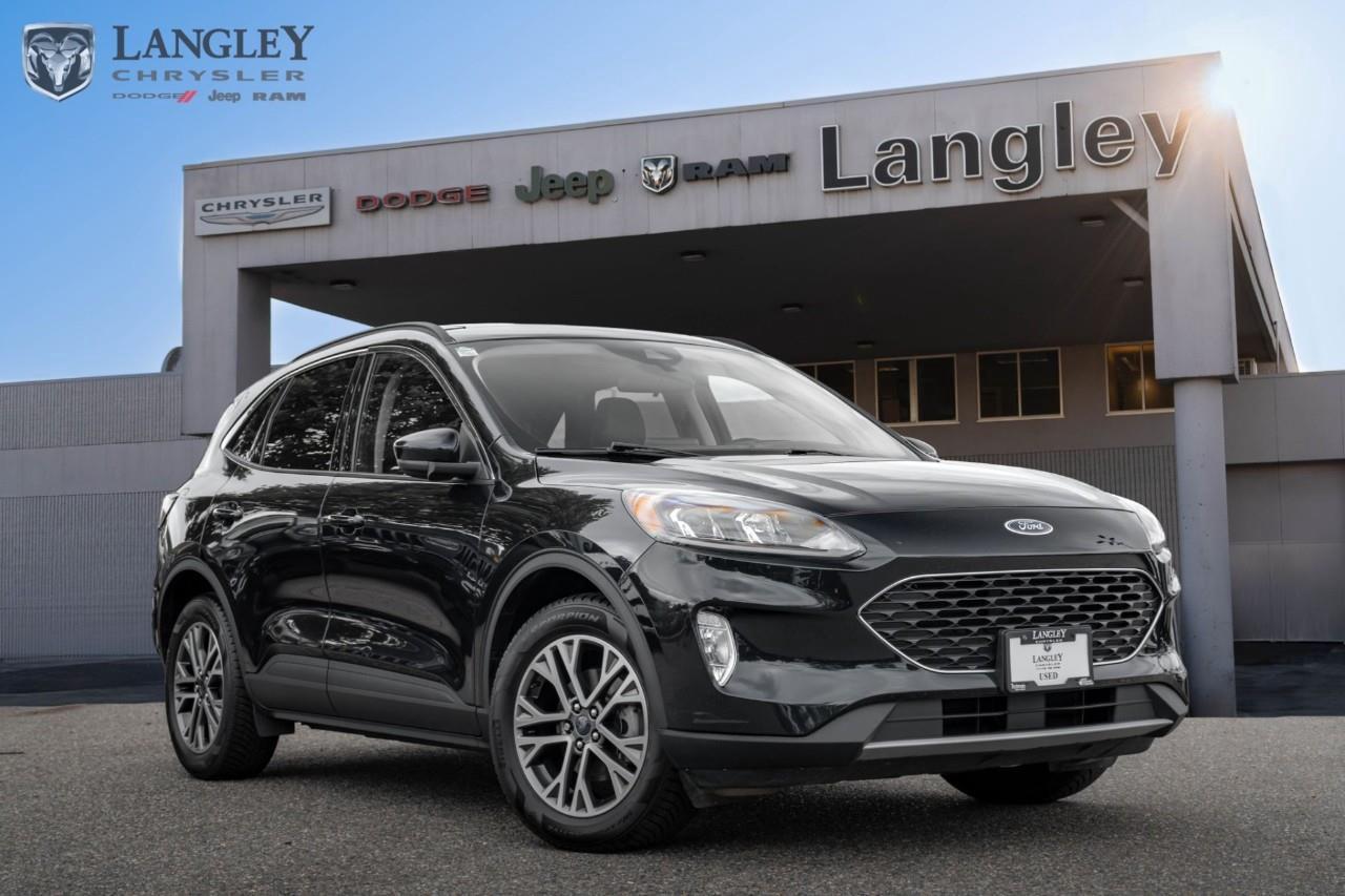 <p><strong>2021 Ford Escape SEL Hybrid AWD</strong></p><p>A versatile and fuel-efficient compact SUV that combines hybrid technology with the added confidence of an all-wheel-drive system.</p><ul><li><p>Engine: 2.5L Atkinson-cycle 4-cylinder hybrid powertrain</p></li><li><p>Combined Power: 200 hp</p></li><li><p>Fuel Economy: 5.9 L/100 km (combined)</p></li><li><p>Transmission: Electronically controlled continuously variable transmission (eCVT)</p></li><li><p>Key Feature: Intelligent all-wheel drive with rear axle disconnect</p></li></ul><p>Come book a test drive at Langley Chrysler, conveniently located in Langley, British Columbia.</p>

<p>*All prices plus applicable taxes, applicable environmental recovery charges, documentation of $599 and full tank of fuel surcharge of $76 if a full tank is chosen. <br />Other protection items available that are not included in the above price:<br />Tire & Rim Protection and Key fob insurance starting from $599<br />Service contracts (extended warranties) for coverage up to 7 years and 200,000 kms starting from $599<br />Custom vehicle accessory packages, mudflaps and deflectors, tire and rim packages, lift kits, exhaust kits and tonneau covers, canopies and much more that can be added to your payment at time of purchase<br />Undercoating, rust modules, and full protection packages starting from $199<br />Financing Fee of $500 when applicable<br />Flexible life, disability and critical illness insurances to protect portions of or the entire length of vehicle loan</p>