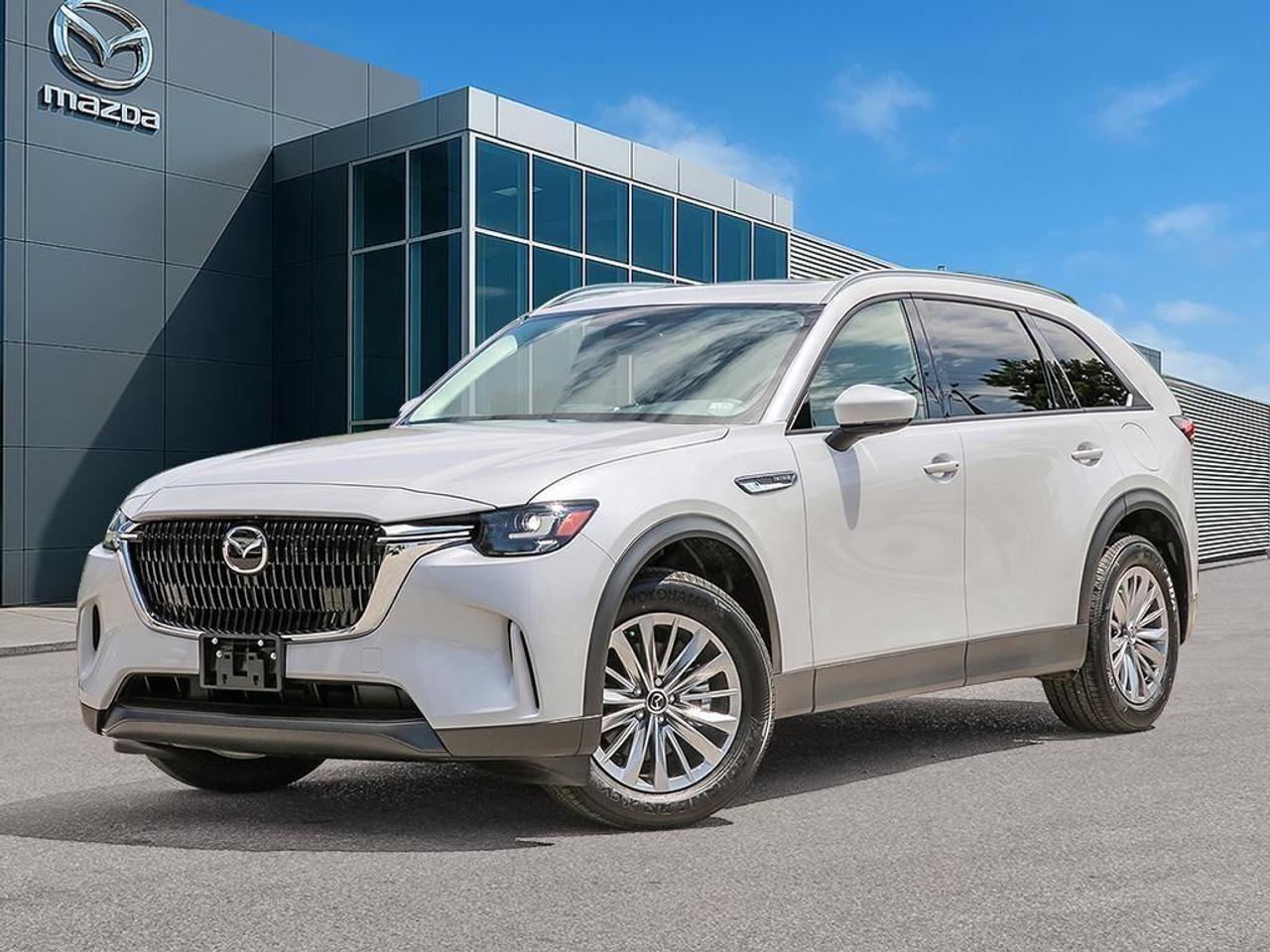 <p>Step into the future with the 2026 Mazda CX-90 MHEV GS-L in a pristine white finish, featuring an AWD drivetrain for superior handling in all conditions. This SUV is crafted not just for utility but also for style, with its RHODIUM WHITE METALLIC exterior that commands attention.</p><p>Inside, you'll find a refined black interior adorned with leatherette upholstery and a leather/metal-look gear shifter, offering both comfort and sophistication. Take advantage of the sunroof/moonroof for a breezy drive, while features like air conditioning, heated seats, and power seats ensure you and your passengers travel in luxury.</p><p>Tech-savvy drivers will appreciate the vehicle's smart device integration, backed by advanced safety and driver assistance technologies, including lane assist, adaptive cruise control, and parking sensors. The backup camera and brake assist work together to enhance safety, giving you peace of mind on every journey.</p><p>Perfect for families or tech enthusiasts, the Mazda CX-90's spacious third-row seating and innovative features make it an ideal choice. With 0.99% Lease APR and special owner loyalty incentives available, now is the perfect time to reach out to Cobourg Mazda for more details on this new 2026 model.</p>