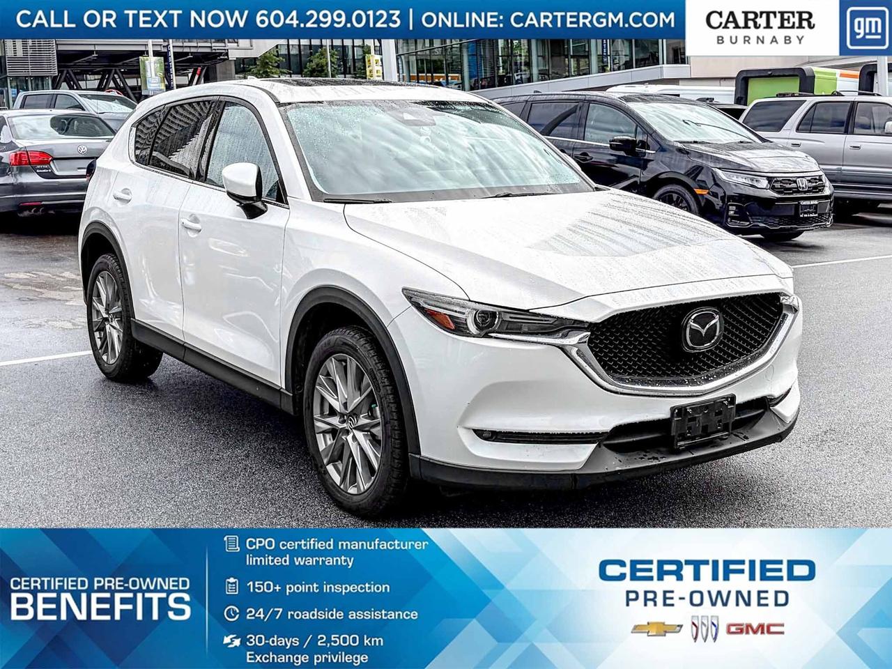 ONE OWNER
Elevate every drive in this 2021 Mazda CX-5 GT AWD, powered by a responsive 2.5L SKYACTIV-G 4-cylinder engine and loaded with premium features including navigation, a power memory drivers seat, heated front seats, and a power liftgate. Enjoy fresh air through the express open/tilt sunroof while advanced safety technologies like Blind Spot Monitoring, Rear Cross Traffic Alert, Smart City Brake Support, and Traction Control System inspire confidence. A 10-speaker audio system completes the experience. Come take it for a test drive today and experience all this stylish vehicle has to offer!

WHY CARTER GM BURNABY?

- An unrivalled vehicle purchasing experience!
- Exceeding our loyal customers expectations since 1963
- 4.5 Google star rating (with 2,300+ customer reviews)
- Cargurus Top-rated Dealer 2025 Award
- Cargurus Top Value Dealer 2025 Award
- 30-day / 2,500 km exchange privilege
- Peace of mind - 150-point vehicle inspection
- CARFAX - full vehicle service history - purchase with confidence!
- Vehicle trades welcome! Best price guaranteed!
- We provide upfront pricing, zero hidden fees, and 100% transparency
- Fast approvals and 99% acceptance rates (no matter your current credit status!)
- Multilingual staff (many languages spoken)
- Comfortable non-pressured environment with in-store television, WIFI and a childrens play area!
- In-store restaurant: fresh daily menu





Were here to help you drive the vehicle you want, the vehicle you deserve!
QUESTIONS? GREAT! WEVE GOT ANSWERS!
To speak with a friendly vehicle specialist - CALL NOW!
The advertised price includes all standard dealer fees and any applicable manufacturer or dealer incentives. It does not include applicable taxes, licensing, insurance, or optional products or services. Dealer fees will be clearly broken out and itemized on the bill of sale, maximum total of fees $595.00. Prices are shown in Canadian dollars. While we make every effort to ensure accuracy, vehicle details, pricing, options, and availability are subject to change without notice. Please confirm all information with dealership sales management before purchase. Dealer Code: 81129