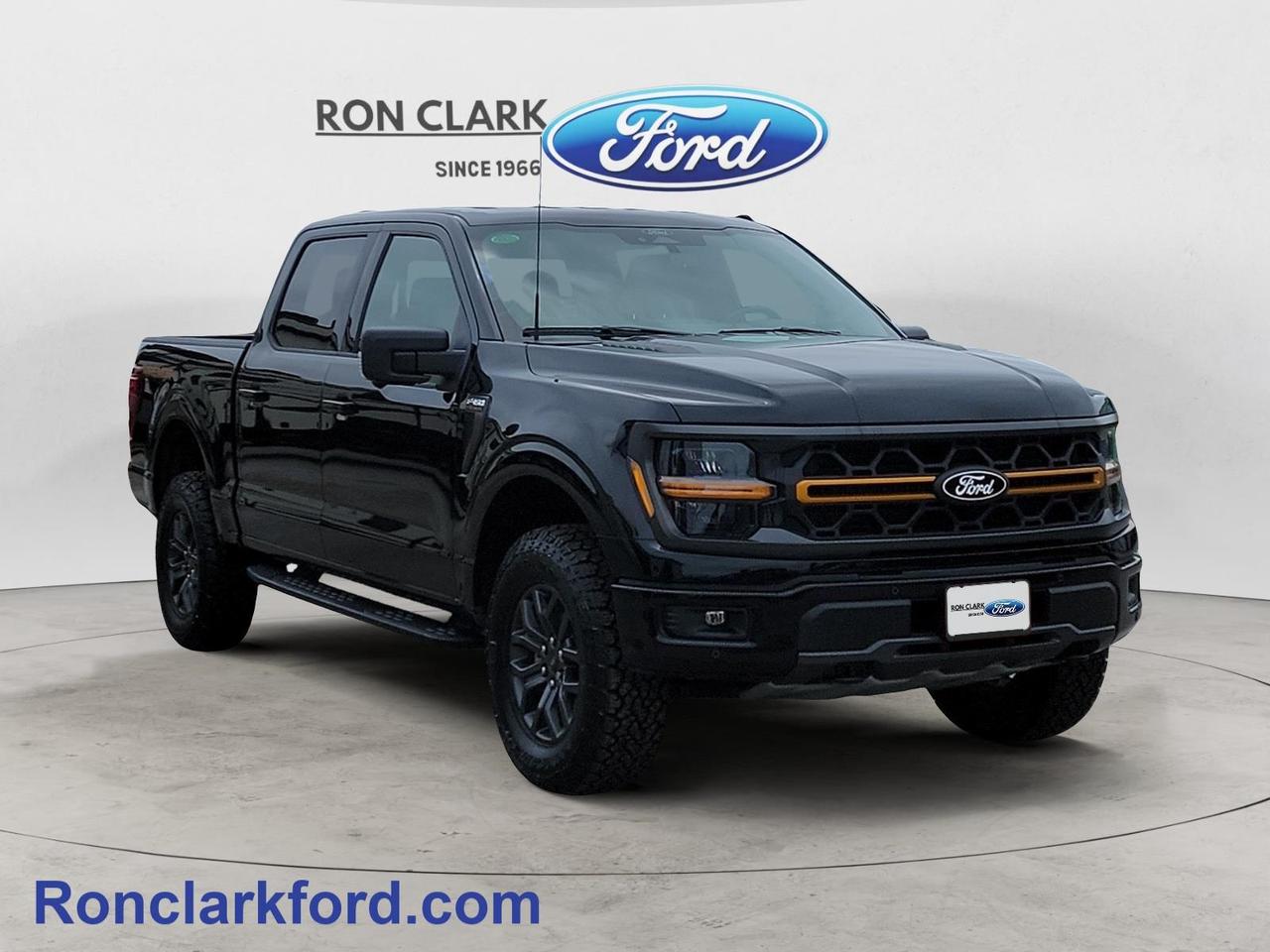 Experience off-road capability without sacrificing everyday comfort in this pre-owned 2025 Ford F-150 Tremor, finished in Agate Black Metallic with a Black Sport Cloth interior. Powered by the proven 3.5L EcoBoost V6 engine paired with a 10-speed automatic transmission, this Tremor delivers impressive power, confidence, and towing capability whether youre heading to the job site, the cottage, or exploring off the beaten path.Built with adventure in mind, it features the Tremor-exclusive front knuckles for enhanced off-road performance, along with the Bed Utility Package featuring a convenient tailgate step to make loading and unloading cargo easier. When its time to tow, youll appreciate the Class IV Trailer Hitch, Trailer Sway Control, Pro Trailer Backup Assist, and Pro Trailer Hitch Assist, helping take the stress out of hauling.Inside, youll find a comfortable and well-equipped cabin with dual-zone automatic climate control, upfitter switches for adding accessories, SYNC 4 with a 12-inch productivity touchscreen, and Lane Keeping System to provide added confidence on every drive.If youre looking for a truck that combines rugged off-road capability, advanced towing technology, and modern comfort, this 2025 Ford F-150 Tremor is ready for whatever comes next. Stop by Ron Clark Ford today to see it for yourself and take it for a test drive.All Pre-Owned vehicles come standard with one key. If we received additional keys from the previous owner they will be with the vehicle upon delivery at no cost. Additional keys may be purchased at customers request and expense.Come to the dealer you can trust. 60 years and counting Ron Clark Ford & Jayco RV is known for great value and being best in customer service! We serve and deliver all over Ontario including destinations such as Wyoming, Petrolia, Sarnia, London, Guelph, Kitchener-Waterloo, Hamilton, GTA, Ottawa & Chatham-Kent. Call or visit us at RON CLARK FORD & JAYCO RV to view and test drive today! RON CLARK FORD where else!!