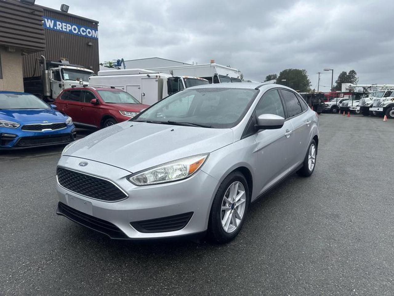 2018 Ford Focus SE Sedan, 2.0L, 4 door, automatic, FWD, 4-Wheel ABS, cruise control, air conditioning, AM/FM radio, power windows, silver exterior, black interior, cloth. (4 brand new tires)  $8,760.00 plus $375 processing fee, $9,135.00 total payment obligation before taxes.   Listing report, warranty, contract commitment cancellation fee, financing available on approved credit (some limitations and exceptions may apply). All above specifications and information is considered to be accurate but is not guaranteed and no opinion or advice is given as to whether this item should be purchased. We do not allow test drives due to theft, fraud, acts of vandalism and undetectable impaired driving. Instead we provide the following benefits: Complimentary Warranty (with options to extend), Limited Money Back Satisfaction Guarantee on Fully Completed Contracts, Contract Commitment Cancellation, and an Open-Ended Sell-Back Option. Ask seller for details or call 604-522-REPO(7376) to confirm listing availability.