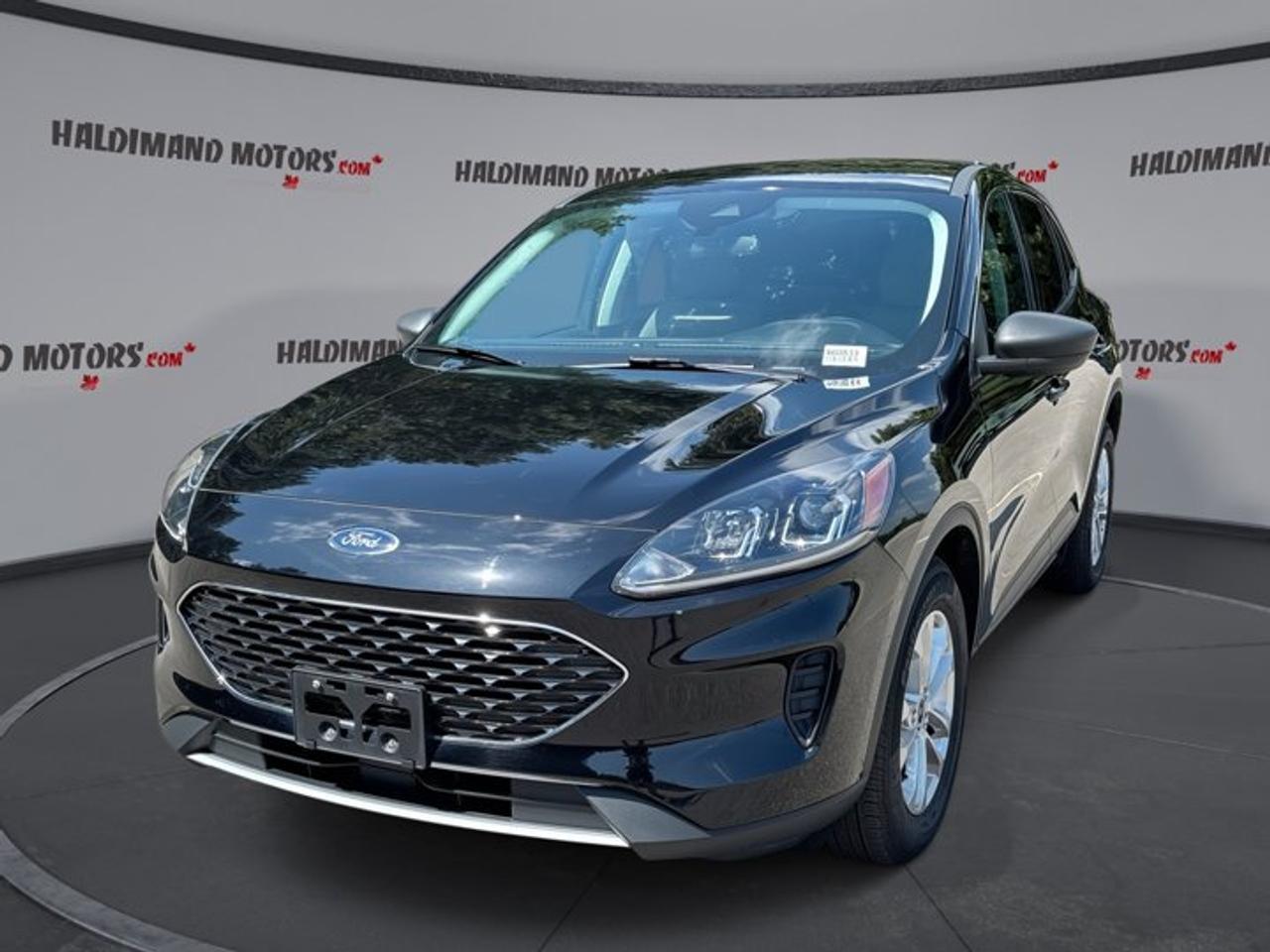 // ACCIDENT FREE!! //<br /><br />This 2022 Ford Escape SE AWD | No Accidents is a smart hybrid SUV for drivers who want comfort, confidence, and great fuel savings. Sold by Haldimand Motors Ltd. in Cayuga, this accident-free Ford Escape SE AWD | No Accidents pairs all-wheel drive with a 2.5-litre hybrid engine and smooth automatic transmission.<br /><br />Finished in Black with a Grey interior, this used hybrid SUV has 40,811 km and a practical 4-door layout. The 2022 Ford Escape SE AWD | No Accidents is easy to enjoy every day, with useful technology, strong safety features, and the efficiency benefits that make a hybrid such a great fit.<br /><br />FEATURES OF THE Escape SE AWD | No Accidents<br /><br />   2.5-litre hybrid powertrain saves fuel daily<br />   All-wheel drive adds year-round confidence<br />   Push button start adds modern ease<br />   Heated front seats help cold mornings<br /><br />HYBRID VEHICLE FEATURES<br /><br />   Hybrid system helps reduce fuel use<br />   Gas-electric power delivers smooth city driving<br />   Regenerative braking supports efficient operation<br />   Quiet low-speed response feels refined daily<br /><br />ADVANCED SAFETY FEATURES<br /><br />   Backup camera helps with reversing confidence<br />   Lane departure warning supports safer travel<br />   Blind spot monitor aids lane changes<br />   Stability control helps maintain secure handling<br /><br />PERFORMANCE AND EFFICIENCY<br /><br />   2.5-litre hybrid balances power and economy<br />   Automatic transmission delivers smooth daily driving<br />   All-wheel drive improves traction in weather<br />   Limited slip differential supports steady grip<br /><br />COMFORT AND CONVENIENCE<br /><br />   Heated front seats add welcome comfort<br />   Front air conditioning keeps cabin pleasant<br />   Power windows simplify everyday operation<br />   Cruise control supports relaxed highway driving<br /><br />TECHNONOLGY AND CONNECTIVITY<br /><br />   Apple CarPlay keeps apps within reach<br />   Android Auto adds easy smartphone access<br />   Bluetooth integration supports hands-free communication<br />   Navigation system helps guide every trip<br /><br />CARGO SPACE<br /><br />   Rear trunk access makes loading easier<br />   Four-door design supports daily family use<br />   Flexible cabin suits errands and travel<br />   Spare tire adds roadside peace<br /><br />AWARDS & RECOGNITIONS<br /><br />   Top Safety Pick, Insurance Institute for Highway Safety, 2022<br /><br />WHAT OTHER OWNERS LIKE<br /><br />   Hybrid efficiency helps lower fuel stops<br />   Comfortable ride suits commuting and trips<br />   Easy-to-use infotainment feels driver friendly<br />   Useful cargo room handles daily needs<br /><br />This hybrid Ford Escape is equipped with many sought-after features that add real value to every drive. Adaptive cruise control helps on longer trips, while automatic headlights, tinted windows, and a rear spoiler add convenience and style. Electric mirrors, power steering, and an adjustable steering wheel help make daily driving simple.<br /><br />Inside, the cabin feels practical and welcoming, with steering wheel audio controls, satellite radio, ambient lighting, and WiFi hotspot capability. Push button start adds convenience, and the illuminated driver and passenger vanity mirrors are thoughtful details. The rear window defroster and automatic door locks also help make this hybrid SUV easy to live with.<br /><br />Safety remains a strong point in this 2022 Ford Escape SE AWD | No Accidents. It includes Anti-Lock Braking System, tire pressure monitoring, child safety locks, driver and passenger airbags, side impact airbags, head side airbags, and a passenger airbag sensor. These features work together to support confidence for family travel, commuting, and weekend driving.<br /><br />For drivers shopping for an accident-free hybrid SUV with all-wheel drive, this 2022 Ford Escape SE AWD | No Accidents stands out with the right mix of efficiency, traction, comfort, and technology. Its black finish, low kilometre reading, and well-equipped feature list make this hybrid Ford Escape a practical and rewarding choice in Cayuga.<br /><br />This 2022 Ford Escape SE AWD | No Accidentss VIN is: 1FMCU9BZ6NUB05400.<br /><br />WHY CHOOSE US? <br /><br />Honest & Transparent Buying Experience: Weve been a trusted name in business since 1984.<br /><br />STRAIGHTFORWARD PRICING:<br />Our Advertised Price Includes:<br />>>Safety Certification (No separate fee!)<br />>>30-Day 100% Mechanical Warranty<br />>>FREE Carfax History Report.<br />>>No upcharge for paying cash.<br />(Prices Exclude HST and Licensing Fees only.)<br /><br />>>Browse 300+ vehicles all in ONE LOCATION<br /><br />EASY FINANCING: Great rates & open loans<br /><br />WE BUY CARS: Get Top Dollar for your trade-in, or sell us your vehicle for CASH! Even if you dont buy from us!<br /><br />STOP BY TODAY<br />Treat yourself - stop by Haldimand Motors Ltd. located at 42 Talbot St E, Cayuga, ON N0A 1E0 to make this car yours today!<br /><br />https://www.haldimandmotors.com/used/stock-460833.html