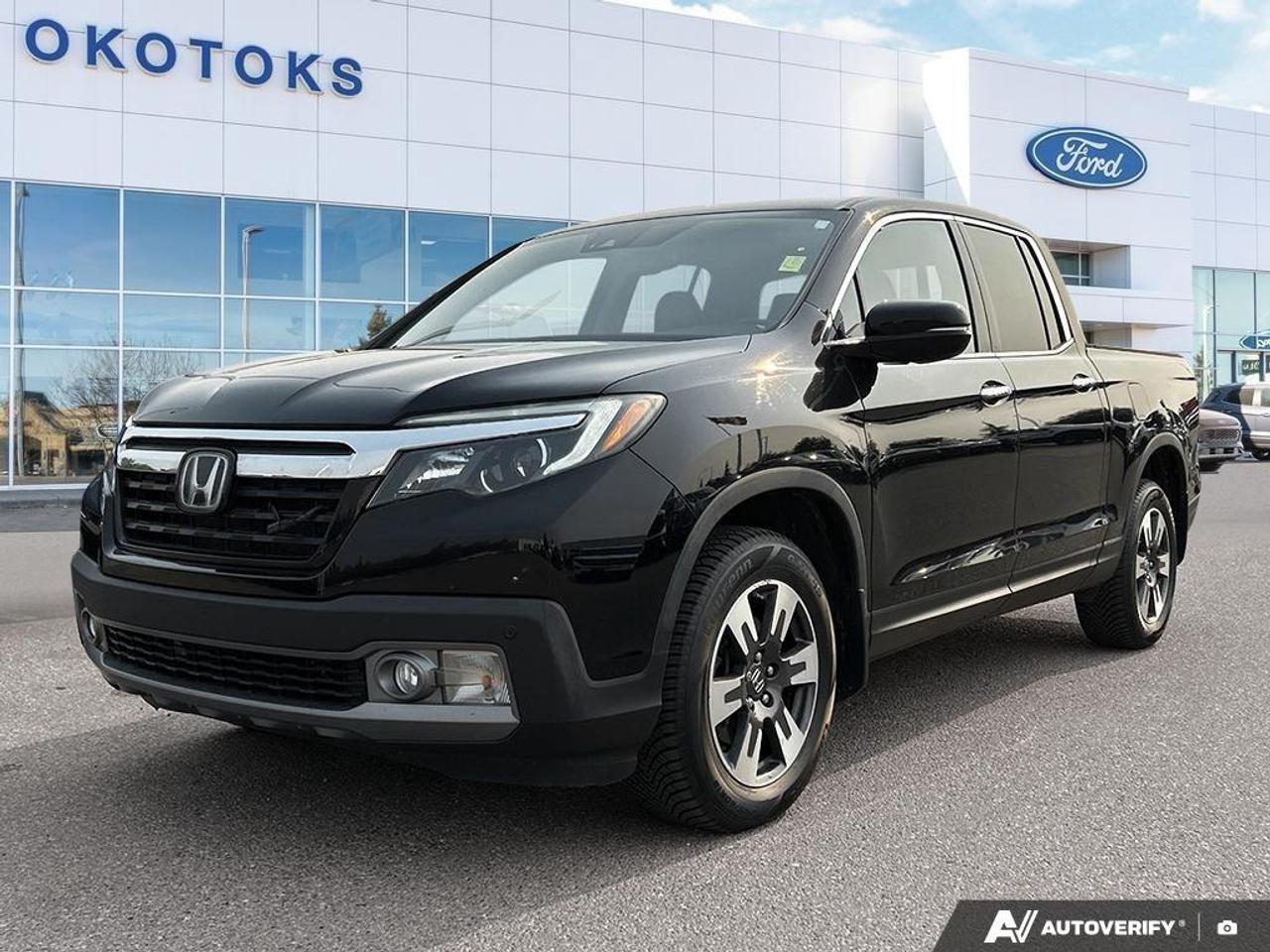 <p>Meet our One Owner 2018 Honda Ridgeline Touring Crew Cab AWD in Crystal Black Pearl and see it delivers an unrivaled blend of ingenuity, functionality, and stylish sophistication! Powered by a 3.5 Litre V6 that delivers 280hp connected to a 6 Speed Automatic transmission for amazing passing requirements. This All Wheel Drive combination delivers a remarkably smooth ride that's superior to other trucks with its fully independent suspension and also rewards you with approximately 9.5L/100km on the highway. Step up to our unique Ridgeline Touring with its dual-action tailgate, sunroof, bed audio system, an integrated trailer hitch, and truck bed lights. You'll also really appreciate the lockable trunk with 7.3 cubic ft of versatile storage that even features a drain so you can use it as a cooler!</p><p>The roomy Touring cabin comfortably seats five and has the most passenger space in its class, as well as a wealth of features including perforated heated/ventilated leather seats, a heated steering wheel, remote engine start, smart entry, an acoustic windshield, HomeLink, and tri-zone automatic climate control. Check out the full power accessories, incredible premium audio with USB, subwoofer, Bluetooth®, Apple CarPlay®, Android Auto®, and a prominent 7-inch display screen!</p><p>You'll hit the ground running without a care in the world since our Honda has been carefully engineered with ABS, stability/traction control, blind spot information, advanced airbags, daytime running lights, a tire pressure monitor, and a rearview camera. This incredible Ridgeline Touring truck absolutely belongs at the top of your list! Save this Page and Call for Availability. We Know You Will Enjoy Your Test Drive Towards Ownership! </p>