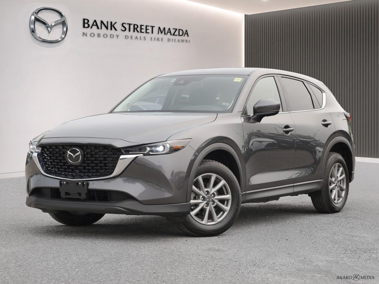 The 2025 Mazda CX-5 GS AWD, cloaked in a sophisticated gray finish, offers exhilarating all-wheel drive for remarkable handling on any journey. Designed for those who appreciate both style and substance, this SUV stands out with its modern silhouette and premium alloy wheels. Step inside to a welcoming interior where comfort and practicality meet. Enjoy the warmth of heated seats and the convenience of power-adjustable seats and windows. A focus on functionality is evident with smart device integration and keyless entry, ensuring a connected and seamless driving experience. Equipped with cutting-edge technology, the Mazda CX-5 keeps you safe and in control with features like a backup camera, brake assist, and lane assist. The Bluetooth connection augments the experience by keeping you linked to your essential devices while the cruise control ensures a relaxed drive. Perfect for families, commuters, or anyone seeking a reliable, stylish, and feature-packed vehicle, the 2025 Mazda CX-5 GS AWD is ready to meet your needs. Contact Bank Street Mazda to learn more about how this exceptional SUV can be yours.