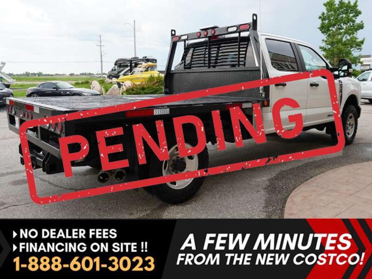 *** Dealer arranged financing on site! Quick, Simple,  no calls or waiting on bank appointments required!! Drive away today ***   NO ADMINISTRATION FEES!!

2023 Ford F-350 XL Crew Cab Super Duty - - 4th Gen 6.7L Power Stroke "Scorpion" heavy-duty turbodiesel V8 engine - - ONLY 60,000 KMS!!!......HUGE VALUE!!!!! Equipped with a heavy-duty FLAT DECK!!! - - Upgraded 10-speed automatic transmission - - 4G LTE Wi-Fi hotspot - - Ford SYNC - - Large touchscreen infotainment system - - Apple CarPlay and Android Auto - - Bluetooth Connectivity - - Remote start - - Rear backup camera - - Drive Mode Selector - - Hill descent controls - - Trailer sway control - - Tow hooks - - Trailer Hitch Receiver - - Towing telescopic heated mirrors - - Towing mirror lights - - 911 Assist - - Power windows  - - Power doors - - Headache rack - - AVS Hood deflector  - - Goodyear Wrangler Duratrac RT w/ Kevlar for extra strength and superior traction.

Fully re-designed Oxford white exterior in excellent condition. Aluminum body. Matte black grille. Spacious interior. 6-passenger layout with a folding center console. Rear folding seats for extra interior cargo space. 

Excellent history! Well maintained. A great addition to your fleet! Low KMS! Great cargo capacity! 

Features

- TorqShift 10-speed automatic
- 4WD
- Flat deck
- Headache Rack
- 6-Passenger seating (with large fold-down center console)
- Touchscreen infotainment system
- Apple CarPlay / Android Auto
- AM/FM Radio
- Bluetooth
- Factory Remote Start
- Towing telescopic mirrors 
- Towing mirror lights
- Heated mirrors
- Steering wheel controls
- Cruise control
- Drive mode Selector
- Fog lights 
- Tow hooks
- Trailer Hitch Receiver
- Power Windows and Locks
- Trailer sway control
- A/C
- Folding rear seats
- Brakes-ABS
- Hill Descent Control
- 17" wheels with Goodyear Wrangler Duratrac RT w/Kevlar
- Rear backup camera
- Molded matte black grille
- AVS Hood deflector
- 4G LTE Wi-Fi hotspot
- Rear Window
Comes with a Manitoba Safety Certification, and we have many Extended Powertrain warranties available on your vehicle purchase up to 10-year coverage (on eligible vehicles see dealer for details). Financing on site with Zero down financing OAC. Trades accepted. View at Winnipeg West Automotive Group, 5195 Portage Ave. (only a couple of minutes past the new Costco) Dealer permit # 6007, Call now. This Car is located in Winnipeg Manitoba,  however we can have it shipped anywhere in North America relatively inexpensively.