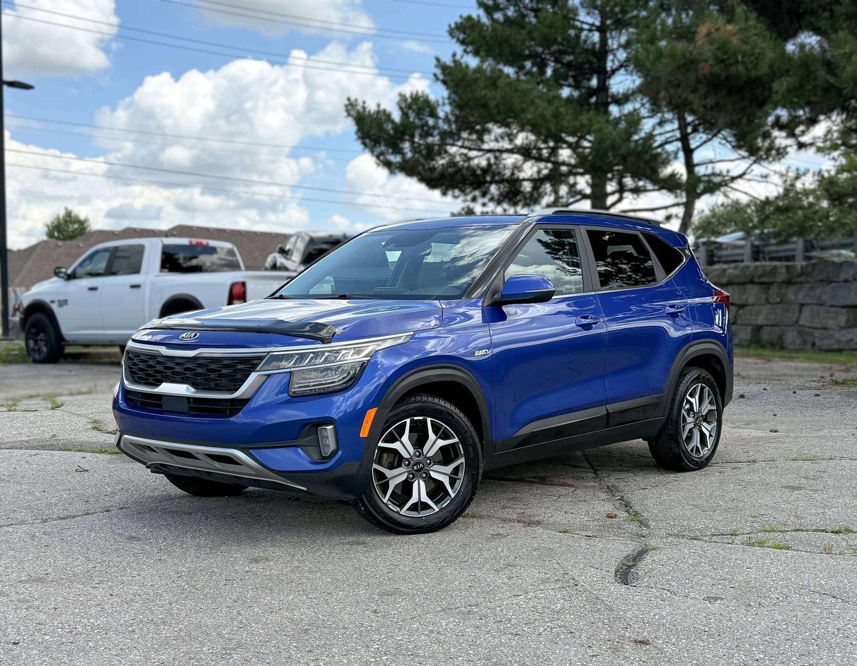 ONLY 1 KEY, NAVIGATION, SUNROOF, BACKUP CAMERA, HEATED SEATS, COOLED SEATS, BLIND SPOT, REMOTE START AND MORE !!!

Our sporty 2021 Kia Seltos EX AWD in Neptune Blue has nimble dimensions that are approximately perfect for city adventures! Powered by a 2.0 Litre 4 Cylinder generating 146hp connected to a CVT for confident travel. You can also enjoy superior traction in our All Wheel Drive SUV that sees approximately 7.6L/100km on the highway. Well-engineered and ready for action, our Seltos supplies LED lighting, fog lamps, a sunroof, roof rails, 17-inch alloy wheels, bold black side sills, and front and rear skid plates for off-road style.

Explore your possibilities from our EX cabin, which is dressed up with heated Sofino front seats, 10-way power for the driver, a leather-wrapped steering wheel, automatic climate control, cruise control, keyless access, pushbutton ignition, and remote start. Keep your phone ready with wireless charging and keep connected with an 8-inch touchscreen, full-color navigation, voice control, Android Auto&reg;, Apple CarPlay&reg;, Bluetooth&reg;, and a six-speaker audio system.

All-around passenger protection comes from Kias safety technologies such as automatic emergency braking, blind-spot monitoring, lane-keeping assistance, a rearview camera, hill start assistance, tire pressure monitoring, a driver attention monitor, and more. Rugged and refined, our Seltos EX is raring to go! Save this Page and Call for Availability. We Know You Will Enjoy Your Test Drive Towards Ownership! 
Bustard Chrysler prides ourselves on our expansive used car inventory. We have over 100 pre-owned units in stock of all makes and models, with the largest selection of pre-owned Chrysler, Dodge, Jeep, and RAM products in the tri-cities. Our used inventory is hand-selected and we only sell the best vehicles, for a fair price. We use a market-based pricing system so that you can be confident youre getting the best deal. With over 25 years of financing experience, our team is committed to getting you approved - whether you have good credit, bad credit, or no credit! We strive to be 100% transparent, and we stand behind the products we sell. For your peace of mind, we offer a 3 day/250 km exchange as well as a 30-day limited warranty on all certified used vehicles.