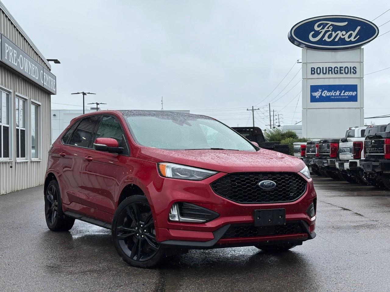 <p>The 2022 Ford Edge ST AWD, cloaked in a vibrant red hue, offers an exceptional driving experience with its AWD capabilities and automatic transmission. This SUV is designed to handle with precision, providing a smooth and confident ride in various conditions.</p><p>The exterior is complemented by stylish alloy wheels, while the interior invites you in with its refined black leather seats and leatherette door trim. The leather steering wheel and heated front seats add a touch of luxury and comfort to your driving experience. With keyless entry and power seats, convenience is at your fingertips.</p><p>Technology is abundant in the Ford Edge ST, featuring a backup camera, smart device integration, and a Wi-Fi hotspot to keep you connected on the go. Safety is a priority with lane assist, parking sensors, and brake assist, ensuring peace of mind for you and your passengers. The innovative 2.7L V6 EcoBoost engine with auto start-stop technology demonstrates Fords commitment to performance and efficiency.</p><p>This SUV is perfect for those who crave a blend of power, style, and modern technology. Whether youre navigating city streets or embarking on a weekend adventure, the Ford Edge ST has everything you need. Contact Bourgeois Motors Ltd. today for more information and take the next step towards owning this impressive vehicle.</p> <p><strong>Why Choose the Bourgeois Auto Group?</strong></p><p>For 80 years, Bourgeois Auto Group has been delivering exceptional automotive experiences. Our factor trained teams work to ensure you receive the shopping experience you deserve; whether you're looking for a new or new-to-you vehicle.</p><p>Shop 24/7 with our online showroom and chat service, ensuring convenience every step of the way. No hidden fees, full disclosure, and every pre-owned vehicle comes with a Carfax® report for peace of mind.</p><p>We offer a wide selection of pre-owned vehicles, all competitively priced using real-time market data. Get the best deal on your purchase and trade-in with our free Live Market Analysis report.</p><p>Looking to sell your car? We buy any make or modelno purchase required. Our simple to use online trade valuation tool will provide you with a clear, transparent selling experience whether you buy our car or not.</p><p>Backed by hundreds dedicated employees across 4 convenient locations, were here to meet all your automotive needs. Visit us in Midland or Parry Sound and explore our inventory or schedule your next service today.</p> <p><strong>Financing Your Next Vehicle with Bourgeois Motors Ford in Midland:</strong></p><p>At Bourgeois Motors Ford, we make financing your next vehicle simple and stress-free! Our team works with trusted lenders to find flexible options tailored to your budget. Drive away with confidenceapply today!</p><p>Take advantage of our online pre-qualification tool, backed by Equifax and TD Bank to find the payment that works for you. Simply <a href=https://www.bourgeoismotors.com/free-credit-check/ rel=nofollow><strong>CLICK HERE</strong></a><strong> </strong>to use our secure online credit tool with no impact to your credit.</p>