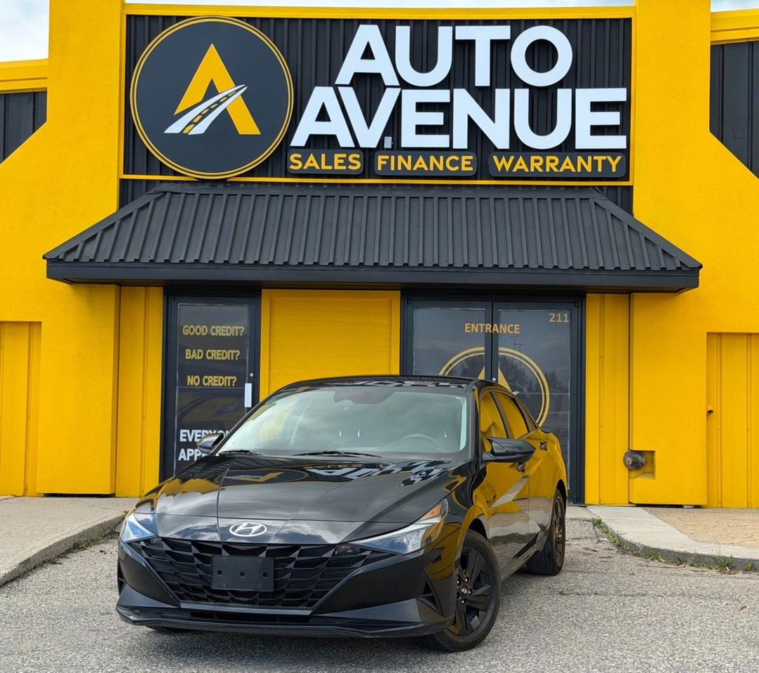 This outstanding example of a 2021 Hyundai Elantra Essential is proudly offered by Auto Avenue Airdrie. <br/> Stylish, efficient, and built with everyday practicality in mind, this 2021 Hyundai Elantra Essential delivers a comfortable driving experience with modern design and impressive value. Whether youre commuting to work, running daily errands, or heading out on a weekend getaway, the Elantra is engineered to make every drive enjoyable. <br/> Inside, youll find a thoughtfully designed cabin with comfortable seating, user-friendly technology, and a spacious interior that provides both driver and passengers with a refined and practical environment. Hyundais reputation for quality, reliability, and fuel efficiency makes the Elantra an excellent choice for a wide range of drivers. <br/> With its sleek exterior styling, responsive handling, and dependable performance, this Elantra Essential offers the perfect balance of comfort, confidence, and affordability. <br/> Reliable, economical, and ready for the road, this 2021 Hyundai Elantra Essential is an outstanding opportunity you wont want to miss. <br/> AUTO AVENUE IS AN AMVIC LICENSED DEALERSHIP, COMMITTED TO PROVIDING EXCEPTIONAL SERVICE AND QUALITY VEHICLES WITH FLEXIBLE PAYMENT OPTIONS. <br/>