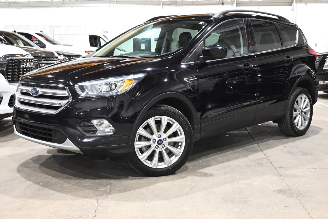 <p><span><font color=#000000><span>Financing & Warranty Available!</span><span><br></span></font></span><span><br></span><span>Accident Free! - Regularly Maintained - Exceptional Condition!</span><br><span><br></span><span>Key Features:</span><span><br></span><span><br></span><span>- Intelligent 4-Wheel Drive (4WD)<br>- Sun & Style Package<br>- Heated Seats<br>- Remote Start<br>- Apple CarPlay & Android Auto Capability<br>- Panoramic Vista Roof<br>- Reverse Sensing System<br>- Rear View Camera<br>- Power Liftgate<br>- Intelligent Access w/ Push-Button Start<br>- Dual-Zone Automatic Climate Control<br>- SYNC 3 w/ 8-Inch LCD Capacitive Touchscreen<br>- FordPass Connect w/ 4G LTE Wi-Fi Hotspot Capability<br>- Leather-Wrapped Steering Wheel & Shift Knob<br>- 10-Way Power Drivers Seat<br>- SiriusXM Satellite Radio<br>- Heated Power Sideview Mirrors<br>- SecuriCode Invisible Keypad<br>- LED Signature Lighting<br>- Fog Lamps<br>- Black Roof-Rack Side Rails<br>- 18-Inch Sparkle Silver-Painted Aluminum Wheels<br>- 1.5L EcoBoost 4-Cylinder Engine<br><br><b>Exterior Colour:</b> Agate Black Metallic<br><b>Interior Colour:</b> Charoal Black ActiveX<br><br><b>Manufacturers Brochure:</b> </span><a href=https://imgcdn.zigwheels.us/brochures/1/8/ford-escape-264075.pdf target=_blank><span>https://imgcdn.zigwheels.us/brochures/1/8/ford-escape-264075.pdf</span></a><span><br><br></span><span>Unlock a full year of exclusive VIP benefits with your purchase! Enjoy 20% off labour, 25% off tires, free windshield stone chip repairs, and so much more. Visit saskatoonauto.ca for all the details.<br></span><span><br>Honesty Pricing eliminates the haggle hassle by providing you with our lowest possible selling price up front. In fact, it is the lowest price in our market, and we will prove it by disclosing a comprehensive market report of what our competitors are selling similar vehicles for.<br></span><span><br>This vehicle meets our Diamond Certification standard, which begins by selecting only premium quality vehicles and subjecting them to a much more comprehensive inspection process than typical dealerships use. Diamond Certified ensures a clean history, exceptional appearance and problem-free operation.<br></span><span><br>At Saskatoon Auto Connection we sell pre-owned automobiles the way we would like to buy them ourselves. Since 2008, we have been dedicated to providing the highest level of integrity and transparency in our industry, in combination with the highest quality vehicles at the most competitive prices in Saskatchewan. Our friendly staff is ready to positively redefine your expectations of the pre-owned automobile space.</span><span></span></p><p></p>