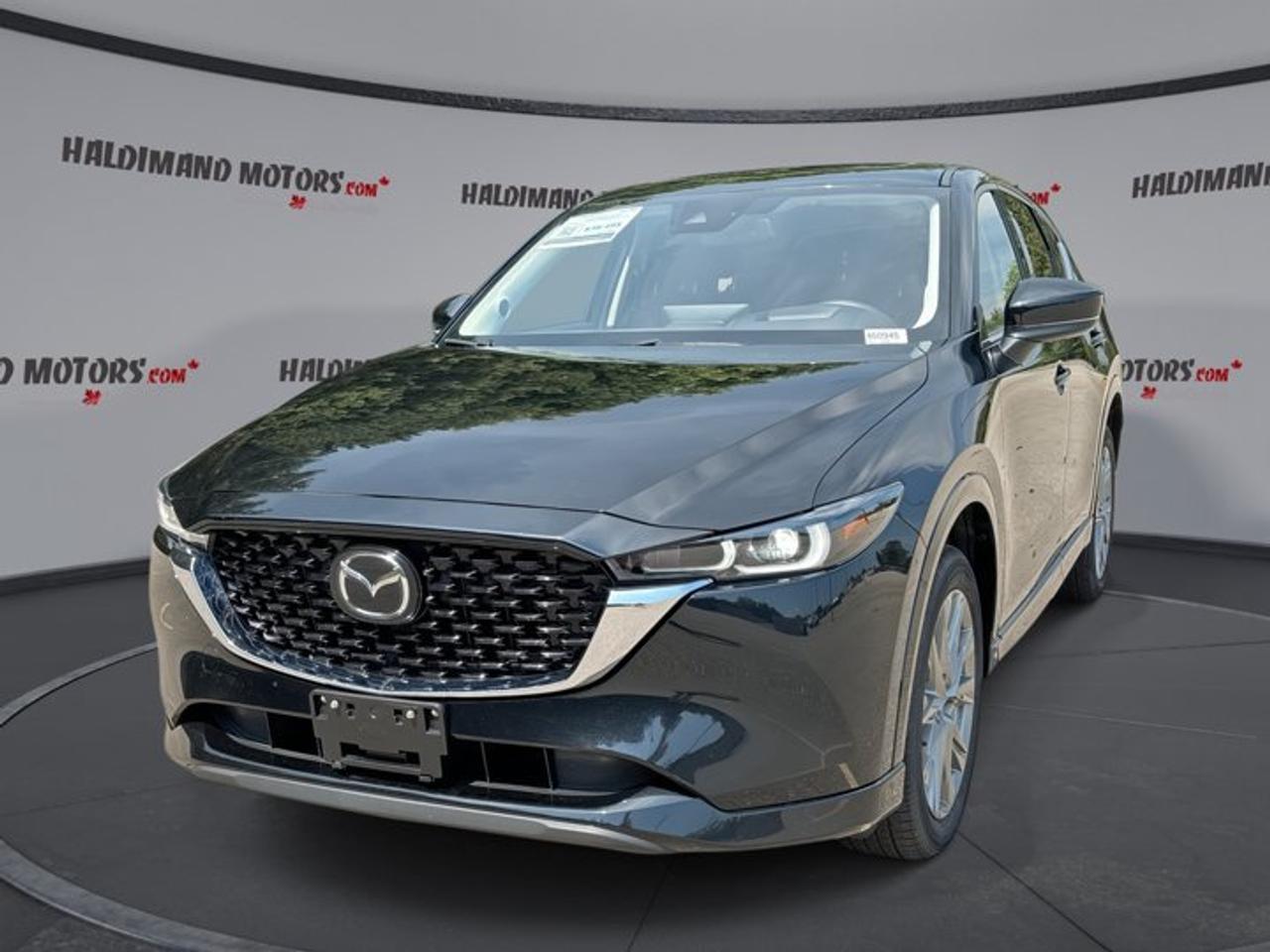 // ACCIDENT FREE!! // <br />// SINGLE OWNER! //<br /><br />This 2025 Mazda CX-5 Sport Design AWD is a sharp, well-kept SUV with one owner, a clean accident-free history, and the comfort drivers want every day. Finished in Black with a Black interior, it blends premium feel, smart utility, and confident all-weather traction in one stylish package.<br /><br />With 46,653 km, this used 2025 Mazda CX-5 Sport Design AWD still feels fresh and ready for many more adventures. Its 2.5-litre gas engine and automatic transmission deliver smooth response, while the four-door layout, sunroof, leather seats, and heated steering wheel add extra appeal for life in Cayuga.<br /><br />FEATURES OF THE CX-5 Sport Design AWD | One Owner | No Accidents | Sunroof | Leather Seats | Heated Steering<br />   One-owner SUV with clean accident-free history<br />   Power sunroof adds light and openness<br />   Heated steering wheel for cold mornings<br />   Black on black premium appearance<br /><br />ADVANCED SAFETY FEATURES<br />   Backup camera helps with tight parking<br />   Blind spot monitor boosts lane awareness<br />   Lane departure warning supports safer travel<br />   Side and head airbags add protection<br /><br />PERFORMANCE AND EFFICIENCY<br />   2.5-litre gas engine feels smooth, responsive<br />   All-wheel drive adds year-round confidence<br />   Six-speed automatic shifts with refined control<br />   Stability control supports secure road manners<br /><br />COMFORT AND CONVENIENCE<br />   Heated front and rear seats included<br />   Dual-zone climate control keeps comfort balanced<br />   Power liftgate simplifies cargo area access<br />   Memory drivers seat adds daily ease<br /><br />TECHNONOLGY AND CONNECTIVITY<br />   Apple CarPlay keeps apps close by<br />   Android Auto adds simple phone integration<br />   Navigation system helps guide every trip<br />   Bluetooth connectivity supports hands-free communication<br /><br />CARGO SPACE<br />   Rear cargo area handles daily gear<br />   Wide liftgate opening eases loading tasks<br />   Split cabin and cargo flexibility helps<br />   Remote trunk release adds extra convenience<br /><br />AWARDS & RECOGNITIONS<br />   Top Safety Pick, Insurance Institute for Highway Safety, 2024<br />   Best Compact Utility Vehicle, Automobile Journalists Association of Canada, 2024<br /><br />WHAT OTHER OWNERS LIKE<br />   Quiet cabin during highway and city driving<br />   Confident all-wheel drive in poor weather<br />   Easy-to-use infotainment and clear controls<br />   Upscale feel with strong everyday comfort<br /><br />This 2025 Mazda CX-5 Sport Design AWD stands out with the right mix of style, function, and driver-focused design. The black exterior gives it a clean, upscale look, while the rear spoiler, tinted windows, LED headlamps, and heated mirrors add useful touches that fit both busy weekdays and weekend travel.<br /><br />Inside, this 2025 Mazda CX-5 Sport Design AWD offers a refined space built for comfort and control. You get front air conditioning, automatic climate control, an adjustable steering wheel, lumbar support for the driver, power seating for both front occupants, and a leather-wrapped steering wheel that feels great in hand.<br /><br />Technology is easy to use in this 2025 Mazda CX-5 Sport Design AWD. A head-up display helps keep key driving information in view, while steering wheel audio controls, satellite radio, HD Radio, and an auto-dimming rearview mirror make each drive more enjoyable and convenient. Push-button start adds a modern touch every time you head out.<br /><br />This 2025 Mazda CX-5 Sport Design AWD also delivers practical value for family use and daily errands. Power windows, power locks, child safety locks, rear window defroster, retractable mirrors, turn signal mirrors, and rear trunk access help make every trip simpler. It is a well-equipped SUV that feels ready for all four seasons in Ontario.<br /><br />For drivers shopping at Haldimand Motors Ltd. in Cayuga, this 2025 Mazda CX-5 Sport Design AWD is a smart choice. It offers the peace of mind of single-owner, accident-free history, the comfort of heated features and a sunroof, and the confidence of Mazda engineering in a versatile compact SUV.<br /><br />This 2025 Mazda CX-5 Sport Design AWD | One Owner | No Accidents | Sunroof | Leather Seats | Heated Steering VIN is: JM3KFBDM1S0663569 .<br /><br />WHY CHOOSE US? <br /><br />Honest & Transparent Buying Experience: Weve been a trusted name in business since 1984.<br /><br />STRAIGHTFORWARD PRICING:<br />Our Advertised Price Includes:<br />>>Safety Certification (No separate fee!)<br />>>30-Day 100% Mechanical Warranty<br />>>FREE Carfax History Report.<br />>>No upcharge for paying cash.<br />(Prices Exclude HST and Licensing Fees only.)<br /><br />>>Browse 300+ vehicles all in ONE LOCATION<br /><br />EASY FINANCING: Great rates & open loans<br /><br />WE BUY CARS: Get Top Dollar for your trade-in, or sell us your vehicle for CASH! Even if you dont buy from us!<br /><br />STOP BY TODAY<br />Treat yourself - stop by Haldimand Motors Ltd. located at 42 Talbot St E, Cayuga, ON N0A 1E0 to make this car yours today!<br /><br />https://www.haldimandmotors.com/used/stock-460945.html