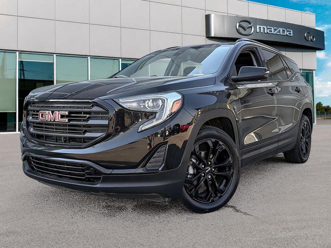 Discover exceptional value with this pre-owned 2021 GMC Terrain SLE AWD in sleek Black! Powered by a fuel-efficient 1.5L Turbo 4-cylinder engine paired to a smooth 9-speed automatic transmission, this Terrain offers confident all-wheel drive and advanced traction control for all-road capability. Inside, enjoy premium cloth heated front bucket seats, an 8-way power driver seat, dual-zone climate control, and the intuitive GMC Infotainment system with a 7 touchscreen and Bluetooth. Safety and convenience abound with features like lane departure prevention, forward collision alert, push-button start, remote start, and a suite of airbags for peace of mind. With spacious seating for five, versatile cargo space, and modern tech throughout, this Terrain blends practicality, comfort, and style. Ready for your next adventureschedule your test drive today!Go Mazda is an AMVIC licensed business.Clean CarFax