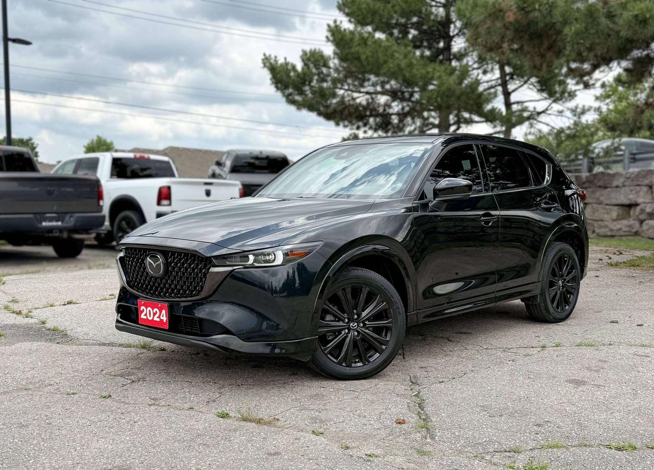 NAVIGATION, SUNROOF, BACKUP CAMERA, BLUETOOTH, HEATED SEATS, COOLED SEATS, BLIND SPOT, BOSE AUDIO AND MORE !!!

Move up to our 2024 Mazda CX-5 Sport Design AWD and start making every mile count in Jet Black Mica! Powered by a 2.5 Litre 4 Cylinder serving up 187hp to a paddle-shifted 6 Speed Automatic transmission for bold acceleration. You can fine-tune performance with Off-road and Sport modes, and this All Wheel Drive SUV returns approximately 7.9L/100km on the highway. Our Mazda CX-5 is dressed for success with LED signature lighting, a power sunroof, an exclusive grille, heated power-folding mirrors, alloy wheels, upsized dual exhaust outlets, a rear spoiler, and gloss-black accents.

Our Sport Design cabin takes care of you and your passengers with heated/ventilated leather power front and heated rear seats, red stitching, a heated leather steering wheel, dual-zone automatic climate control, and keyless access/ignition. Technologically advanced, this interior also showcases a 10.25-inch display, a multifunction controller, full-colour navigation, off-road navigation, wireless charging, wireless Apple CarPlay&reg;/Android Auto&reg;, Bluetooth&reg;, voice control, and a Bose sound system.

Smart Mazda safety measures include adaptive cruise control, a rearview camera, blind-spot monitoring, automatic braking, lane-keeping assistance, rear cross-traffic alert, and more to stay safe and sound. Sleek and sophisticated, our Mazda CX-5 Sport Design elevates everyday driving with extraordinary poise! Save this Page and Call for Availability. We Know You Will Enjoy Your Test Drive Towards Ownership! 

Bustard Chrysler prides ourselves on our expansive used car inventory. We have over 100 pre-owned units in stock of all makes and models, with the largest selection of pre-owned Chrysler, Dodge, Jeep, and RAM products in the tri-cities. Our used inventory is hand-selected and we only sell the best vehicles, for a fair price. We use a market-based pricing system so that you can be confident youre getting the best deal. With over 25 years of financing experience, our team is committed to getting you approved - whether you have good credit, bad credit, or no credit! We strive to be 100% transparent, and we stand behind the products we sell. For your peace of mind, we offer a 3 day/250 km exchange as well as a 30-day limited warranty on all certified used vehicles.