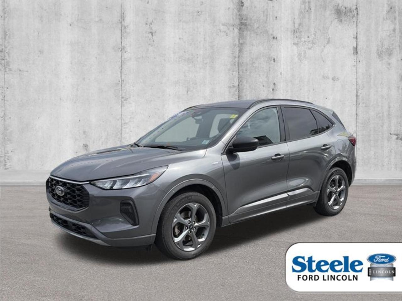 Recent Arrival!Carbonized Gray Metallic2023 Ford Escape Hybrid ST-LineAWD eCVT 2.5L iVCTVALUE MARKET PRICING!!, 2.5L iVCT.ALL CREDIT APPLICATIONS ACCEPTED! ESTABLISH OR REBUILD YOUR CREDIT HERE. APPLY AT https://steeleadvantagefinancing.com/6198 We know that you have high expectations in your car search in Halifax. So if youre in the market for a pre-owned vehicle that undergoes our exclusive inspection protocol, stop by Steele Ford Lincoln. Were confident we have the right vehicle for you. Here at Steele Ford Lincoln, we enjoy the challenge of meeting and exceeding customer expectations in all things automotive.