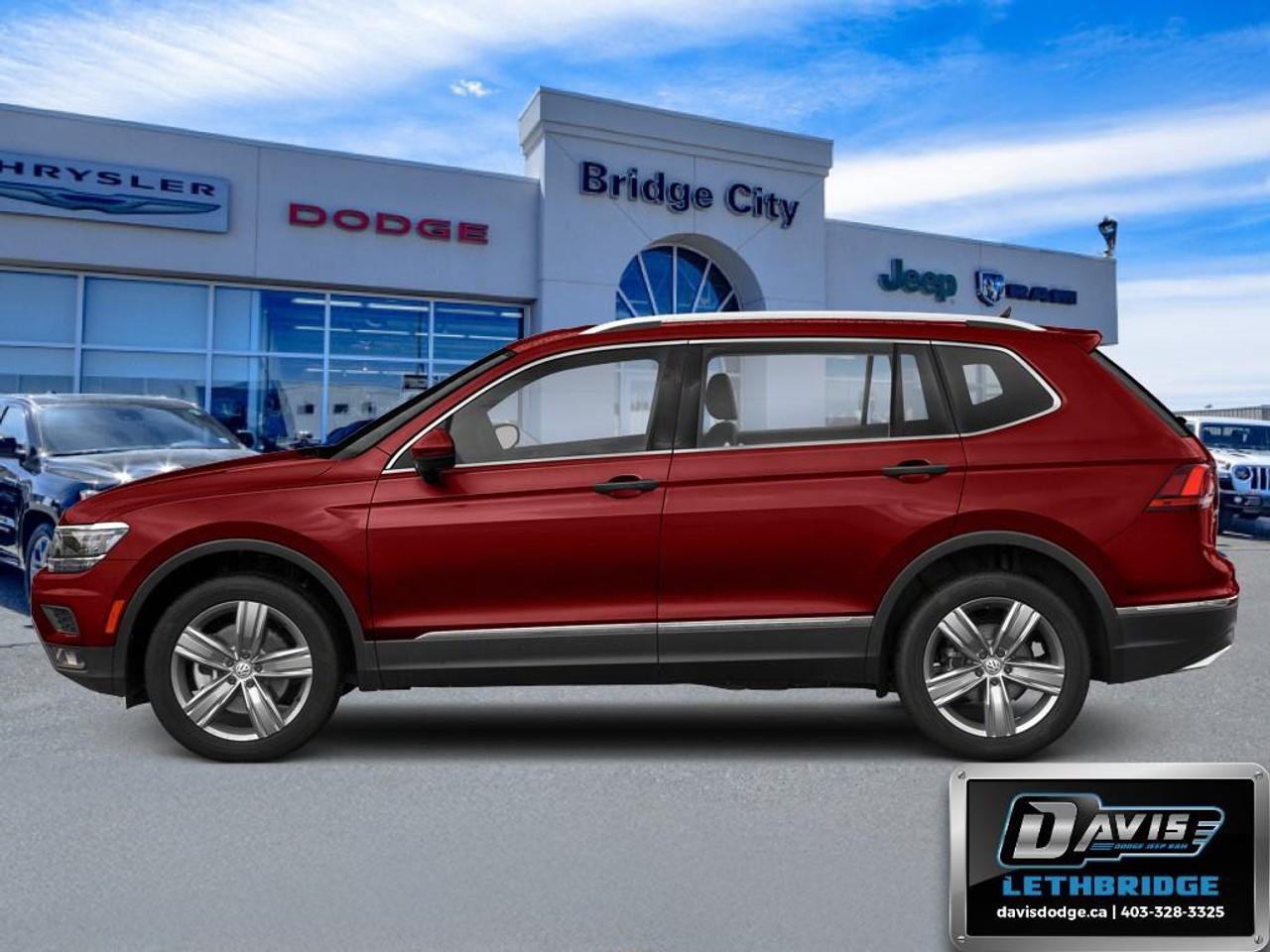 <b>Low Mileage, Navigation, Sunroof, Leather Seats, Heated Seats, Premium Sound Package!</b><br /> <br /> Completely redesigned and more refined than the last model this new 2018 Volkswagen Tiguan is better than ever. This 2018 Volkswagen Tiguan is fresh on our lot in Lethbridge.<br /> <br />The 2018 Volkswagen Tiguan is completely redesigned and much more refined this year. With a more aggressive and masculine front hood, and all around design tweaks, the new Tiguan is becoming the undisputed king of the city streets. There is more of everything in the new Tiguan including more legroom, more options to choose from and more power. The new and improved Tiguan is the best choice for a new compact SUV.<br /> <br />This low mileage SUV has just 55,874 km. Stock number 41772 is Red in colour. It has an Automatic transmission and is powered by a 184HP 2.0L 4 Cylinder Engine. It may have some remaining factory warranty, please check with dealer for details. <br /> <br /> Our Tiguan's trim level is Highline 4MOTION. Towering above the competition, this luxuriously fitted out Tiguan Highline 4MOTION has all the best gadgets and features VW has to offer. Options include upgraded stylish aluminum wheels, power sunroof with sunshade, roof rack rails, LED brake lights, front fog lamps, Fender Digital Audio system with 8 speakers, satellite navigation, voice control, App-Connect smart phone integration, SiriusXM, Bluetooth, heated power front seats, leather upholstered seats front and rear, proximity entry, push button start, cruise control, dual zone front automatic air, door mirrors and drivers seats memory control, blind spot sensor, back up camera, forward and rear collision alerts, front and rear parking sensors and much more. This vehicle has been upgraded with the following features: Navigation, Sunroof, Leather Seats, Heated Seats, Premium Sound Package, Rear View Camera, Bluetooth.<br /> <br />To apply right now for financing use this link: <a href=https://lethbridge.davisdodge.ca/free-credit-check/ target=_blank rel=nofollow noopener noreferrer>https://lethbridge.davisdodge.ca/free-credit-check/</a><br /> <br /><br />Locally Owned & Trusted for Over 35 Years  Davis Dodge in Lethbridge, AB <br /><br /> At Davis Dodge, weve proudly served the Lethbridge community for more than 35 years, offering an unparalleled car buying experience. Dont just take our word for itour Google reviews speak volumes about our commitment to exceptional service. <br /><br /> Delivery & At-Home Test Drives: Convenient options to suit your lifestyle. <br /><br /> Flexible Financing for Everyone: Get the vehicle you need with financing solutions tailored to your situation. <br /><br /> Full Mechanical Inspections & Professional Cleaning: Every vehicle is thoroughly inspected and cleaned before it hits our lot.<br /><br /> We take all makes and models on trade and offer competitive pricing with inventory that changes daily. Whether you're shopping for a Chrysler, Dodge, Jeep, RAM, or FIAT, our AMVIC Licensed dealership makes it easy to browse, buy, and drive away.<br /><br /> Located in Lethbridge, AB, we proudly serve customers in Fort Macleod, Taber, Claresholm, and Coaldale. Shop online or visit us today to experience the best in sales, service, and selection. Standard bank rates apply; taxes are additional.<br /><br /> Vehicle pricing offer shown expires 2026-07-31. <br /> Come by and check out our fleet of 40+ used cars and trucks and 110+ new cars and trucks for sale in Lethbridge. o~o