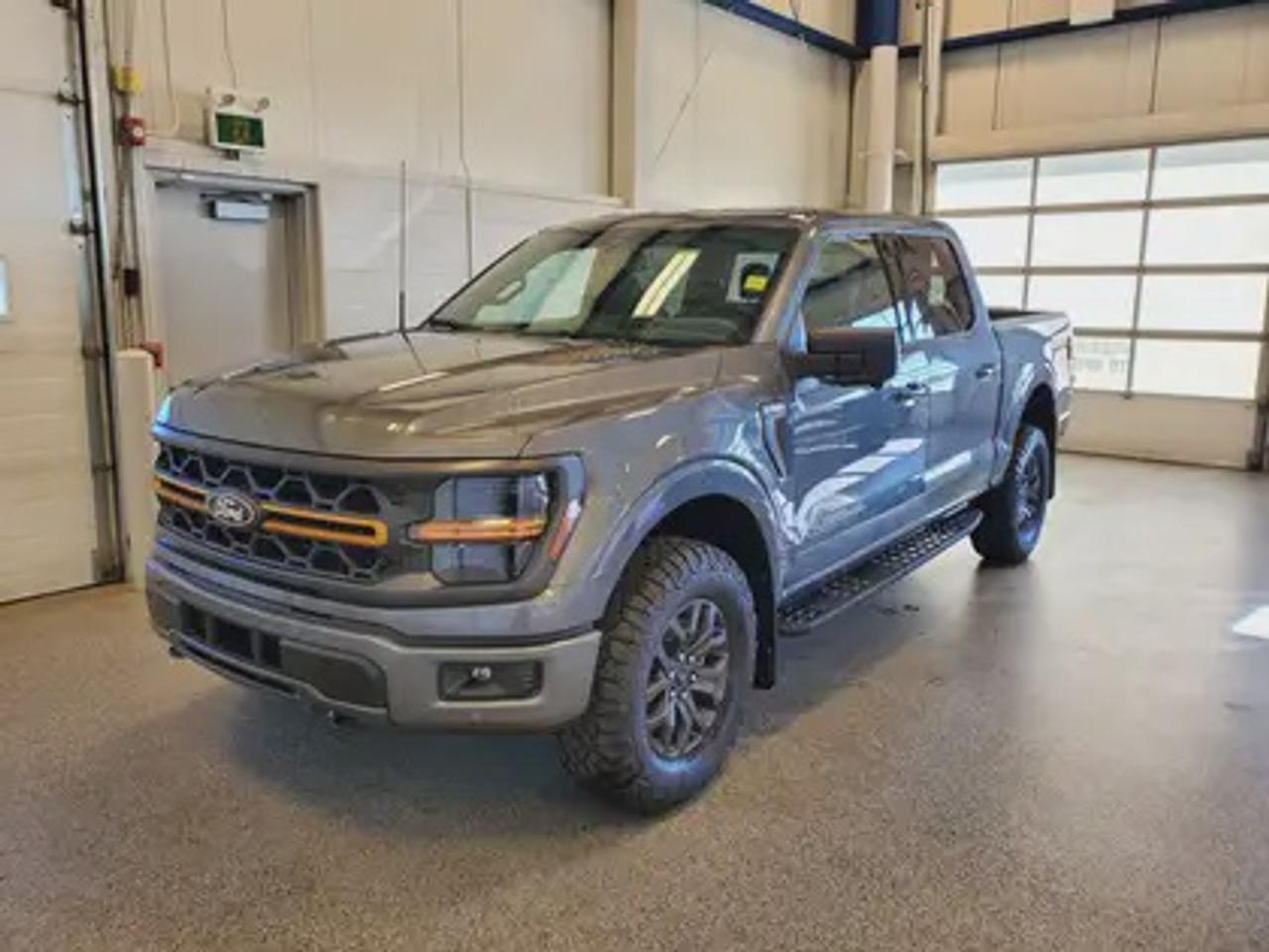 The all-new 2026 Ford F-150 Tremor 401A looks absolutely stunning in Carbonized Grey Metallic. This pickup comes with the 3.5L EcoBoost® engine, delivering an impressive 400 horsepower and 500 lb-ft of torque. With EcoBoost® technology and a 10-speed automatic transmission, this truck achieves a highway/city fuel economy of 12.9L/100km (22 miles per gallon) combined highway/city. 

Key Features:
Selectable Drive Modes
18 Alloy W/ Dark Matte Finish Wheels
Heated Front Seats
Ford Co-Pilot 360 Assist 2.0
Adaptive Cruise Control
Lane Centering
Evasive Steering Assist
Front Parking Sensors
Pro Trailer Backup Assist
Pro Trailer Hitch Assist
BlueCruise
8 Speaker B&O Sound System
Hill Descent Control
Remote Start System
Tailgate Removable w/Lock
Trailer Hitch Class IV

Saskatchewans extreme weather conditions and rugged terrain are no match for the 2026 F-150 Tremor. This truck is engineered to take on the toughest environments, featuring a 3.73 Electronic Locking Rear Axle, Heavy-Duty Front and Rear Off-Road Shocks, Unique Tremor Control Arms, AWD with Mechanical Locking 4WD. Whether youre hitting the trails or tackling tough jobs, the F-150 Tremor offers a perfect balance of performance, capability, and technology.
