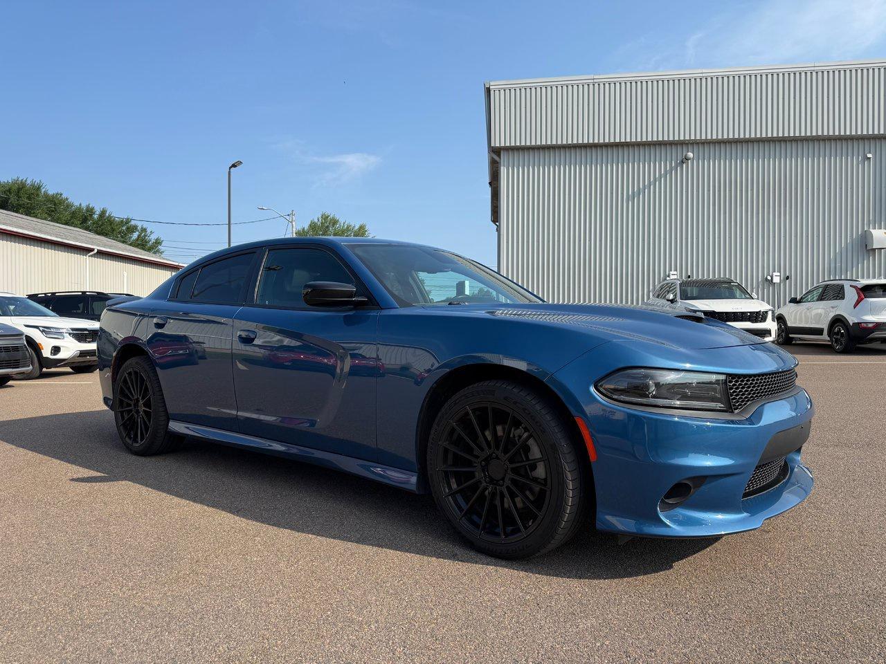 <p data-path-to-node=0>Four-door utility meets authentic muscle in the 2023 Dodge Charger GT. Under the hood, a high-output Pentastar V6 delivers a robust 300 horsepower and 264 lb-ft of torque. The Chargers GT trim maximizes street presence with an aggressive performance hood, functional scoop, sculpted side sills, 20-inch aluminum wheels, and a signature LED racetrack taillamp.

<p data-path-to-node=2>&nbsp;

<p data-path-to-node=2>Inside, the Chargers driver-centric cabin features a customisable 7-inch digital gauge cluster and an 8.4-inch Uconnect touchscreen with Apple CarPlay and Android Auto. High-end comfort items include dual-zone automatic temperature control, premium cloth sport seats, and a leather-wrapped steering wheel with paddle shifters. An on-demand all-wheel-drive system with front-axle disconnect is available to seamlessly tackle Canadian winters without sacrificing rear-wheel-drive dynamics.




<span style=font-weight: 400;>Thank you for your interest in this vehicle. Its located at Centennial Kia of Summerside, 670 Water Street, Summerside, PEI. We look forward to hearing from you; call us at&nbsp;1-902-724-4542.</span>