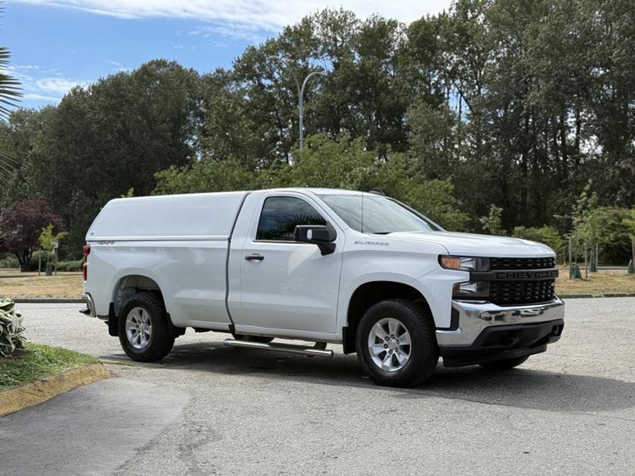 This 2019 Chevrolet Silverado 1500 Work Truck Regular Cab is powered by a 4.3L EcoTec3 V6 paired with an automatic transmission and four-wheel drive. Configured with a long box, this full-size pickup offers a practical platform for commercial, fleet, and everyday hauling applications.

Equipped with an ATC truck canopy, this Silverado provides enclosed cargo storage for tools, equipment, and supplies. Additional features include a trailer package, Apple CarPlay and Android Auto smartphone integration, backup camera, rear parking sensors, and power windows, power door locks, and power mirrors. Four-wheel drive adds capability in a variety of road and weather conditions.

Finished in white with a gray cloth interior, this Silverado 1500 combines a full-size pickup platform with an enclosed cargo area and a range of convenience features. This item is currently OFFSITE. You must register an appointment with our office to schedule an offsite viewing. Appointments must be made a minimum of one business day in advance (and as defined by the days that Repo.com is open for business) before your appointment can be scheduled and confirmed. We may, at our own discretion, instead opt to transport smaller items to Repo.coms main yard for viewing purposes.  $34,920.00 plus $375 processing fee, $35,295.00 total payment obligation before taxes.   Listing report, warranty, contract commitment cancellation fee, financing available on approved credit (some limitations and exceptions may apply). All above specifications and information is considered to be accurate but is not guaranteed and no opinion or advice is given as to whether this item should be purchased. We do not allow test drives due to theft, fraud, acts of vandalism and undetectable impaired driving. Instead we provide the following benefits: Complimentary Warranty (with options to extend), Limited Money Back Satisfaction Guarantee on Fully Completed Contracts, Contract Commitment Cancellation, and an Open-Ended Sell-Back Option. Ask seller for details or call 604-522-REPO(7376) to confirm listing availability.