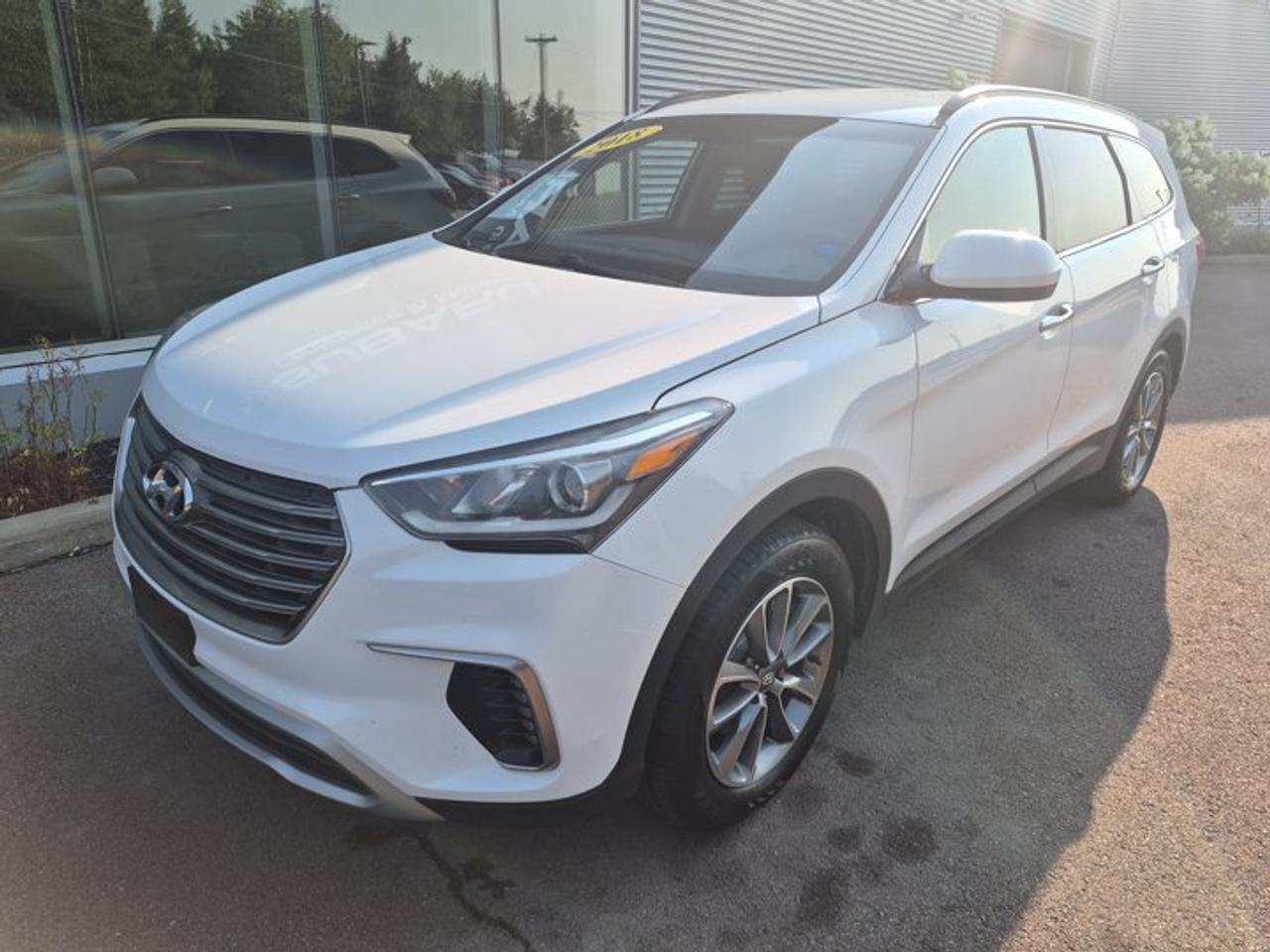 **2018 Hyundai Santa Fe XL Base 3-Row SUV | Spacious Interior | Family Friendly | Reliable & Versatile**Discover comfort, practicality, and impressive passenger capacity with this **2018 Hyundai Santa Fe XL Base**. Designed for families and active lifestyles, the Santa Fe XL offers three-row seating, generous cargo space, and a smooth, confident driving experience for daily commuting, road trips, and everything in between.Powered by a capable 3.3L V6 engine paired with a smooth automatic transmission, the Santa Fe XL delivers strong performance while providing the versatility expected from a full-size SUV. Available All-Wheel Drive adds confidence and traction when road conditions change, making it a great choice for year-round driving.Inside, youll find a spacious cabin with seating for up to seven passengers, comfortable cloth upholstery, air conditioning, Bluetooth® connectivity, steering wheel-mounted controls, and a rearview camera for added convenience. With flexible second- and third-row seating, the Santa Fe XL makes it easy to accommodate passengers, cargo, and family adventures.**Key Features:*** 3.3L V6 engine* Automatic transmission* Available All-Wheel Drive* 7-passenger seating* Bluetooth® hands-free calling and audio streaming* Rearview camera* Steering wheel-mounted audio controls* Cruise control* Air conditioning* Power windows, locks, and mirrors* Remote keyless entry* Split-folding second-row seats* Fold-flat third-row seating* Spacious cargo area* Roof rails* Alloy wheels* Traction and stability controlOffering exceptional space, comfortable seating, strong V6 performance, and everyday practicality, this **2018 Hyundai Santa Fe XL Base** is an excellent choice for families and drivers needing extra room without sacrificing comfort. Contact us today to schedule your test drive!