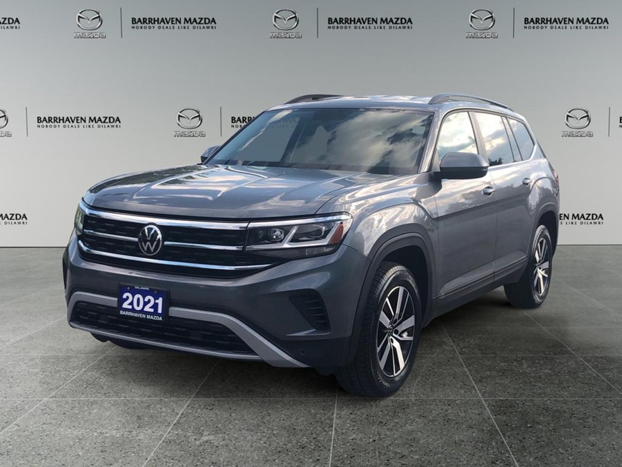 Explore the 2021 Volkswagen Atlas Comfortline in a refined gray finish, engineered with all-wheel drive for exceptional handling on Canadian roads. This SUV is perfect for family adventures and city explorations alike. The Atlas Comfortline boasts a spacious and comfortable interior equipped with convenient features like heated seats, a third-row, and power-adjustable seating, ensuring comfort for every passenger. Alloy wheels accentuate its bold exterior styling, while the convenience of keyless entry and remote start means youre ready to hit the road with ease. Stay connected and safe with advanced technology features such as Bluetooth connection, satellite radio, and smart device integration. A backup camera, lane assist, and parking sensors enhance safety and driver confidence, providing peace of mind for every journey. Cruise control and brake assist further contribute to a relaxed and secure driving experience. This SUV is an ideal choice for families seeking versatility combined with modern comforts and safety. Contact Barrhaven Mazda today to schedule a test drive and learn more about how this outstanding 2021 Volkswagen Atlas Comfortline can meet your needs.