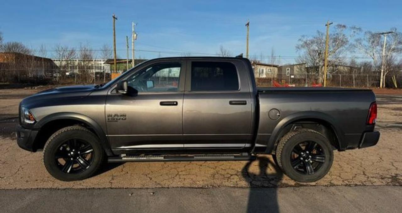 Come see this certified 2021 Ram 1500 Classic Warlock 4x4 | Sport Hood | Heated Seats + Steering | Remote Start | CarPlay + Android Auto & More !. Its Automatic transmission and 3.6 L engine will keep you going. This Ram 1500 Classic comes equipped with these options: Reverse Camera, Remote Start, Heated Steering Wheel, Air Conditioning, Heated Seats, Tilt Steering Wheel, Steering Radio Controls, Power Windows, Power Locks, and Traction Control. Test drive this vehicle at Mark Wilsons Better Used Cars, 5055 Whitelaw Road, Guelph, ON N1H 6J4.MASSIVE SELECTION: 500+ vehicles in ONE LOCATION, all Live Market Priced for the best value!STRAIGHTFORWARD & TRANSPARENT PRICING: Our Advertised Price INCLUDES:Safety Certification! (No separate certification fee upcharge).FREE Carfax History Report!NO upcharge for paying cash!CONFIDENCE & PEACE OF MIND: 30-Day/3,000 km Warranty INCLUDED! Plus a 5-Day Exchange Privilege!*EASY FINANCING: Better-than-bank rates, $0 Down, and 3 Months No Payments available OAC. BAD CREDIT APPROVED HERE!WE BUY CARS: Get Top Dollar for your trade, or sell us your vehicle for CASH even if you dont buy ours!www.shopwilsons.comAn Honest, Transparent Buying Experience. Trusted in business since 1961!(Cash Prices Exclude HST and Licensing Fees only.)