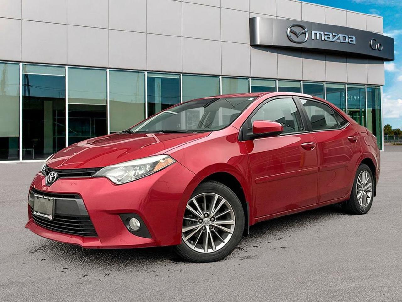 Drive home reliability and style with this pre-owned 2015 Toyota Corolla LE sedan in eye-catching Barcelona Red Metallic! Powered by an efficient 1.8L 4-cylinder DOHC engine paired with a smooth Continuously Variable (CVTi-S) transmission, this Corolla offers a comfortable and fuel-smart ride. Enjoy heated front bucket seats with premium fabric trim, a 6.1-inch display with AM/FM/CD and MP3 player, plus hands-free wireless connectivity. Safety is top-notch with 8 airbags, ABS brakes, traction and stability control. Practical features like power windows, keyless entry, and fold-forward rear seats provide convenience for every trip. Dont miss out on this well-equipped, dependable sedanperfect for city driving or your daily commute. Stop by Go Mazda today and experience the value and quality the 2015 Corolla LE delivers!Go Mazda is an AMVIC licensed business.This vehicle has been registered in Ontario