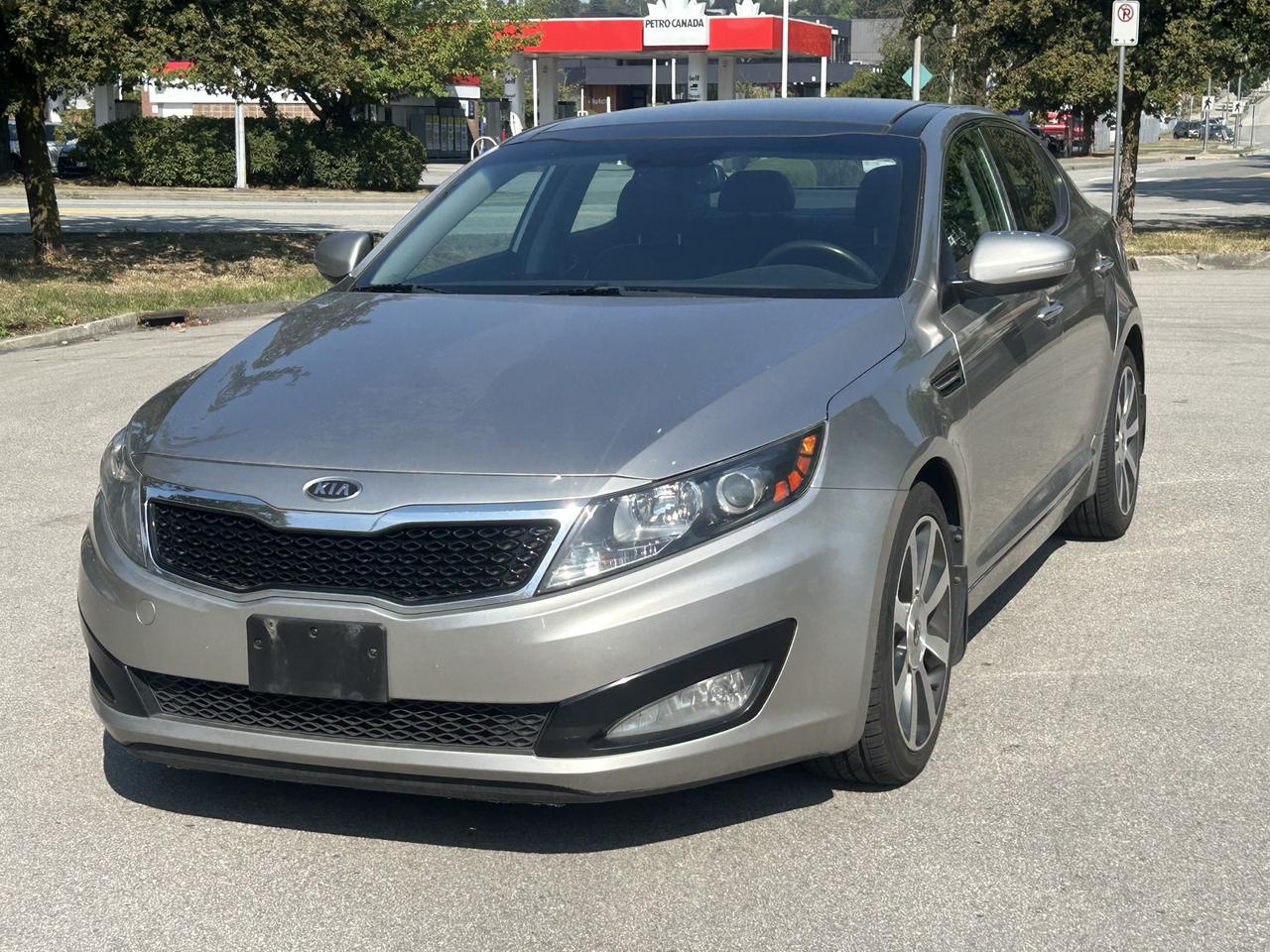 <p>Looking for a stylish and well-equipped sedan that wont break the bank? Milani Auto Sales has the perfect pre-owned option for you: a 2012 Kia Optima EX LUXURY. This sleek, four-door sedan offers a comfortable and enjoyable driving experience, whether youre commuting around the city or heading out for a weekend getaway. Its sophisticated design and refined interior make it a standout choice in the used car market.</p><p>Step inside the 2012 Kia Optima EX LUXURY and youll discover a cabin designed for your comfort and convenience. The automatic transmission ensures smooth gear changes, making for effortless driving, while the front-wheel drive provides reliable traction in various conditions. This Optima is ready to be your next trusted companion on the road, offering a great blend of practicality and sophisticated features.</p><p>Here are five features that truly make this 2012 Kia Optima EX LUXURY shine:</p><ul><li><strong>EX LUXURY Trim:</strong> Experience a premium feel with the top-tier EX LUXURY trim, packed with upscale amenities designed to enhance your driving pleasure.</li><li><strong>Heated and Ventilated Seats:</strong> Stay perfectly comfortable year-round with seats that can be both heated for those chilly Canadian winters and ventilated for refreshing coolness on hot summer days.</li><li><strong>Panoramic Sunroof:</strong> Open up your cabin and enjoy the sky above with a spacious panoramic sunroof, bringing in natural light and a sense of airiness.</li><li><strong>Premium Audio System:</strong> Immerse yourself in rich, clear sound with a high-quality audio system, transforming every drive into a concert hall experience.</li><li><strong>Leather Upholstery:</strong> Sink into the luxurious feel of supple leather seats, adding a touch of sophistication and enhanced comfort to your daily journeys.</li></ul><p><strong><em>Powered by AutoIntelligence&trade;</em></strong></p><p>Vehicle information has been generated using artificial intelligence and is provided for informational purposes only. While efforts are made to ensure accuracy, please confirm all details directly with the dealer.</p>