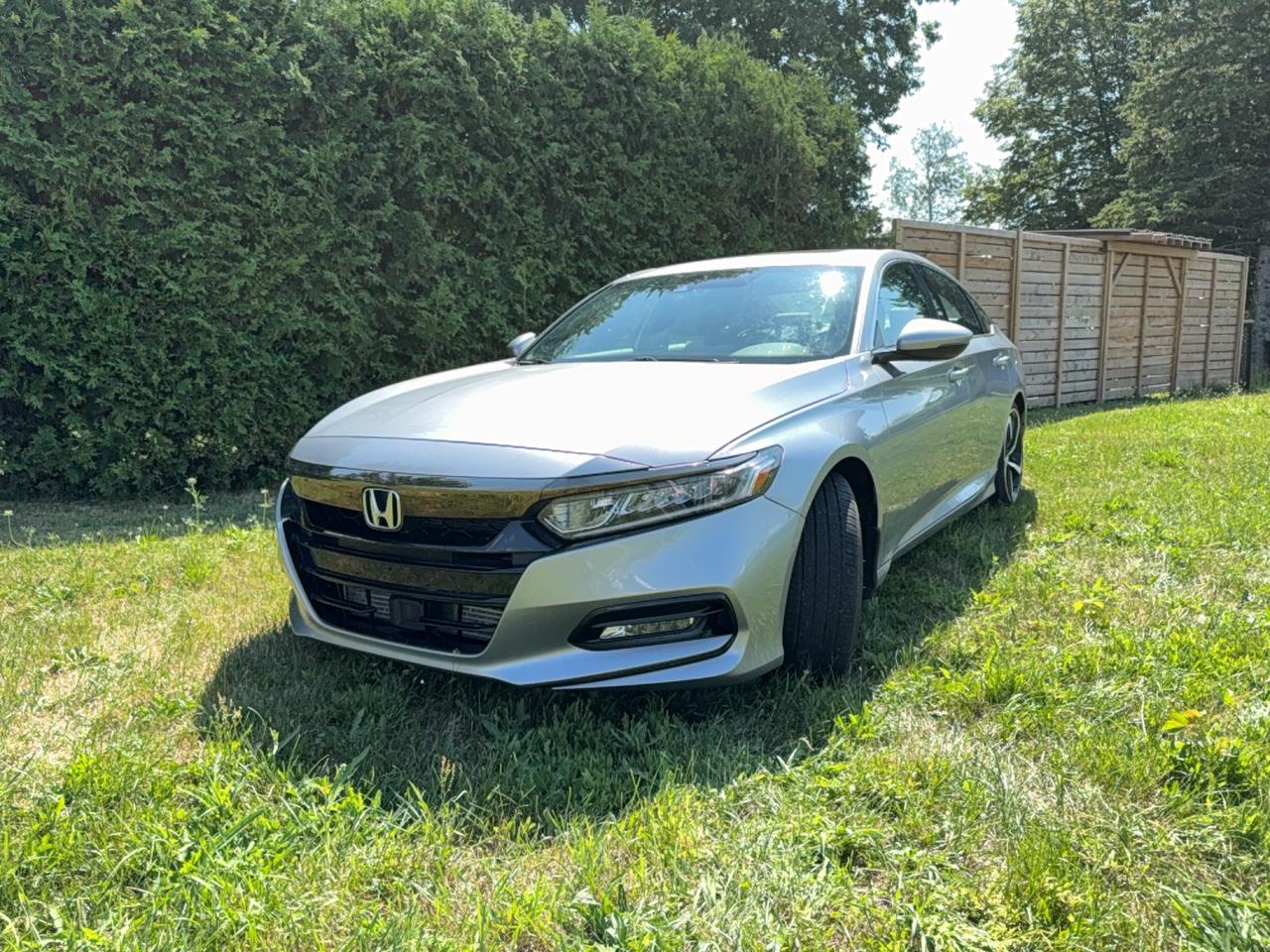 <p>Imagine yourself behind the wheel of this sleek, silver 2020 Honda Accord Sport, a sedan designed for both sophisticated style and exhilarating performance. Its dynamic lines and modern silhouette are sure to turn heads, while the comfortable black interior provides a refined sanctuary for every drive. Whether youre navigating city streets or embarking on a weekend getaway, this Accord Sport offers a smooth and engaging driving experience, powered by a fuel-efficient gasoline engine and a responsive Variable/CVT transmission. With only 55,560 kilometers on the odometer, this well-maintained vehicle is ready to deliver years of reliable service and driving pleasure. At King Auto Sales & Finance, were proud to offer this exceptional sedan.</p><p>This 2020 Honda Accord Sport isnt just a car; its a statement. It embodies the perfect blend of practicality and sportiness, making it an ideal choice for discerning drivers who refuse to compromise. Experience the joy of owning a vehicle that feels as good to drive as it looks.</p><p>Here are 5 features that make this Accord Sport truly stand out:</p><ul><li><strong>Sport Trim Enhancements:</strong> Experience a more athletic feel with the Sport trim, designed to offer a dynamic driving experience that excites.</li><li><strong>Modern and Stylish Design:</strong> The silver exterior gleams, complemented by a sleek sedan body style that exudes sophistication and modernity.</li><li><strong>Fuel-Efficient Gasoline Engine:</strong> Enjoy impressive fuel economy without sacrificing power, making your daily commute and longer journeys more budget-friendly.</li><li><strong>Smooth and Responsive CVT Transmission:</strong> The Variable/CVT transmission provides seamless acceleration and a consistently smooth ride, optimizing performance and efficiency.</li><li><strong>Comfortable Black Interior:</strong> Sink into the well-appointed black interior, offering a premium and comfortable environment for both driver and passengers.</li></ul><p><strong><em>Powered by AutoIntelligence&trade;</em></strong></p><p>Vehicle information has been generated using artificial intelligence and is provided for informational purposes only. While efforts are made to ensure accuracy, please confirm all details directly with the dealer.</p>