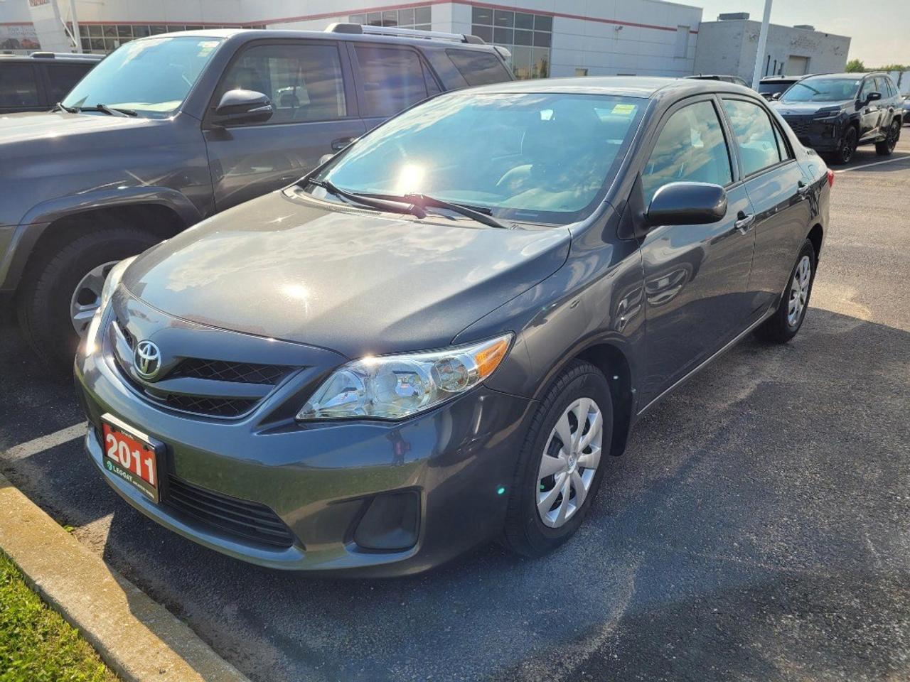 Take a look at this very well maintained Corolla CE. Nicely equipped with full power group, newer tires, struts, exhaust, control arms and brakes. If you are looking for a great commuter car or student car look no further. This accident free sedan is finished in magnetic grey over grey cloth.