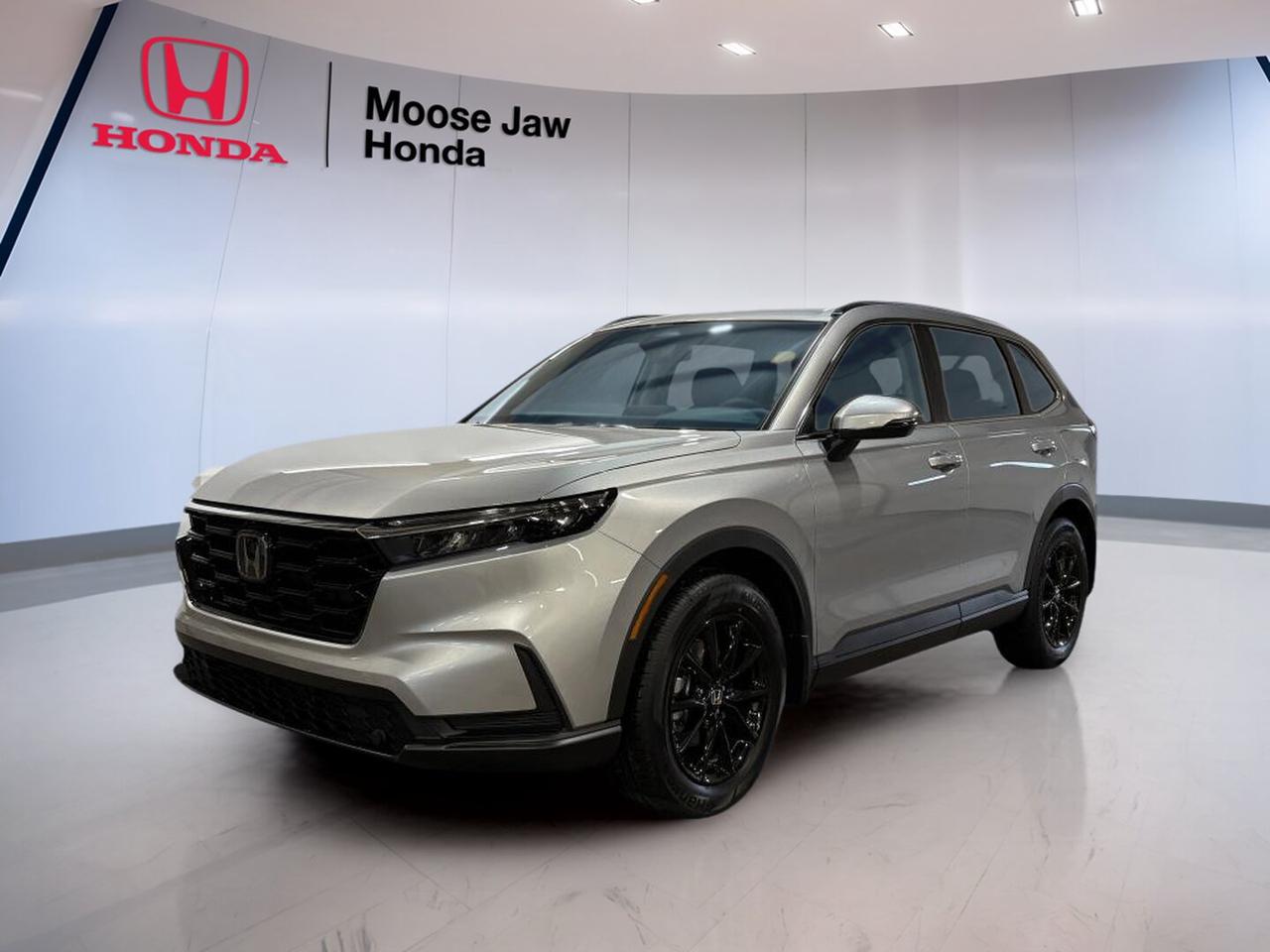 Discover the confidence and everyday versatility of the brand new 2026 Honda CR-V Sport at Moose Jaw Honda in Moose Jaw. Finished in Silver with a Black interior, this compact SUV blends smart design, all-weather capability, and turbocharged performance for Canadian drivers who want comfort, efficiency, and practical space in one well-rounded package.

The 2026 Honda CR-V Sport brings a refined look and a strong road presence without giving up the easy manners that make it ideal for city trips, highway travel, and family use. With all-wheel drive, a continuously variable transmission, and a 1.5 litre 16-valve DOHC turbocharged 4-cylinder engine, it is built to handle daily driving with smooth power delivery.

FEATURES OF THE CR-V Sport

»» Sport styling adds bold visual appeal
»» Standard all-wheel drive for added confidence
»» Turbocharged power supports smooth everyday driving
»» Versatile SUV design suits active lifestyles

ADVANCED SAFETY FEATURES

»» Honda Sensing helps support safer driving
»» Collision mitigation braking can assist stopping
»» Lane keeping assist helps maintain position
»» Road departure mitigation adds extra confidence

PERFORMANCE AND EFFICIENCY

»» 1.5 litre turbocharged four-cylinder engine
»» Continuously variable transmission shifts with smoothness
»» All-wheel drive improves year-round traction
»» Balanced power for daily commuting needs

COMFORT AND CONVENIENCE

»» Spacious cabin supports everyday passenger comfort
»» Four-door access makes entry and exit easy
»» Black interior offers a clean look
»» Well-planned layout improves daily usability

TECHNOLOGY AND CONNECTIVITY

»» Driver-focused controls are easy to reach
»» Clear displays help monitor key information
»» Modern cabin design supports connected driving
»» User-friendly interface keeps functions simple

CARGO SPACE

»» Rear cargo area supports active lifestyles
»» Flexible storage helps carry daily essentials
»» SUV design allows practical loading access
»» Roomy layout adds family-friendly usefulness

WHAT OTHER OWNERS LIKE

»» Smooth ride quality in daily driving
»» Useful cargo room for busy lifestyles
»» Confident all-wheel drive in poor weather
»» Easy controls and comfortable cabin layout

The 2026 Honda CR-V Sport is a smart choice for drivers who need one vehicle to do many jobs well. It offers the elevated seating position many SUV shoppers want, along with the efficiency benefits of a smaller footprint that is easy to park and easy to live with every day.

Its turbocharged engine is designed to give responsive performance when merging, passing, or heading out on longer drives. The continuously variable transmission helps deliver power in a smooth, steady way, while standard all-wheel drive adds peace of mind when roads in Saskatchewan become wet, snowy, or uneven.

Inside, the Black interior gives this SUV a modern and tidy feel. The cabin is made to support both driver and passengers with practical space, simple controls, and the flexibility expected from a popular compact SUV. Whether you are loading groceries, sports gear, or travel bags, the cargo area is ready for real daily use.

For drivers shopping for a brand new SUV with proven Honda engineering, practical size, and year-round confidence, the 2026 Honda CR-V Sport deserves a close look. Visit Moose Jaw Honda in Moose Jaw and see how this Silver CR-V Sport fits your lifestyle.

This 2026 Honda CR-V Sports VIN is: 2HKRS4H52TH116560.<p>Discover the confidence and everyday versatility of the brand new 2026 Honda CR-V Sport at Moose Jaw Honda in Moose Jaw. Finished in Silver with a Black interior</p>
<p> and practical space in one well-rounded package.

The 2026 Honda CR-V Sport brings a refined look and a strong road presence without giving up the easy manners that make it ideal for city trips</p>
<p> it is built to handle daily driving with smooth power delivery.

FEATURES OF THE CR-V Sport

»» Sport styling adds bold visual appeal
»» Standard all-wheel drive for added confidence
»» Turbocharged power supports smooth everyday driving
»» Versatile SUV design suits active lifestyles

ADVANCED SAFETY FEATURES

»» Honda Sensing helps support safer driving
»» Collision mitigation braking can assist stopping
»» Lane keeping assist helps maintain position
»» Road departure mitigation adds extra confidence

PERFORMANCE AND EFFICIENCY

»» 1.5 litre turbocharged four-cylinder engine
»» Continuously variable transmission shifts with smoothness
»» All-wheel drive improves year-round traction
»» Balanced power for daily commuting needs

COMFORT AND CONVENIENCE

»» Spacious cabin supports everyday passenger comfort
»» Four-door access makes entry and exit easy
»» Black interior offers a clean look
»» Well-planned layout improves daily usability

TECHNOLOGY AND CONNECTIVITY

»» Driver-focused controls are easy to reach
»» Clear displays help monitor key information
»» Modern cabin design supports connected driving
»» User-friendly interface keeps functions simple

CARGO SPACE

»» Rear cargo area supports active lifestyles
»» Flexible storage helps carry daily essentials
»» SUV design allows practical loading access
»» Roomy layout adds family-friendly usefulness

WHAT OTHER OWNERS LIKE

»» Smooth ride quality in daily driving
»» Useful cargo room for busy lifestyles
»» Confident all-wheel drive in poor weather
»» Easy controls and comfortable cabin layout

The 2026 Honda CR-V Sport is a smart choice for drivers who need one vehicle to do many jobs well. It offers the elevated seating position many SUV shoppers want</p>
<p> along with the efficiency benefits of a smaller footprint that is easy to park and easy to live with every day.

Its turbocharged engine is designed to give responsive performance when merging</p>
<p> or heading out on longer drives. The continuously variable transmission helps deliver power in a smooth</p>
<p> the Black interior gives this SUV a modern and tidy feel. The cabin is made to support both driver and passengers with practical space</p>
<p> the cargo area is ready for real daily use.

For drivers shopping for a brand new SUV with proven Honda engineering</p>
<p> the 2026 Honda CR-V Sport deserves a close look. Visit Moose Jaw Honda in Moose Jaw and see how this Silver CR-V Sport fits your lifestyle.

This 2026 Honda CR-V Sports VIN is: 2HKRS4H52TH116560.</p>