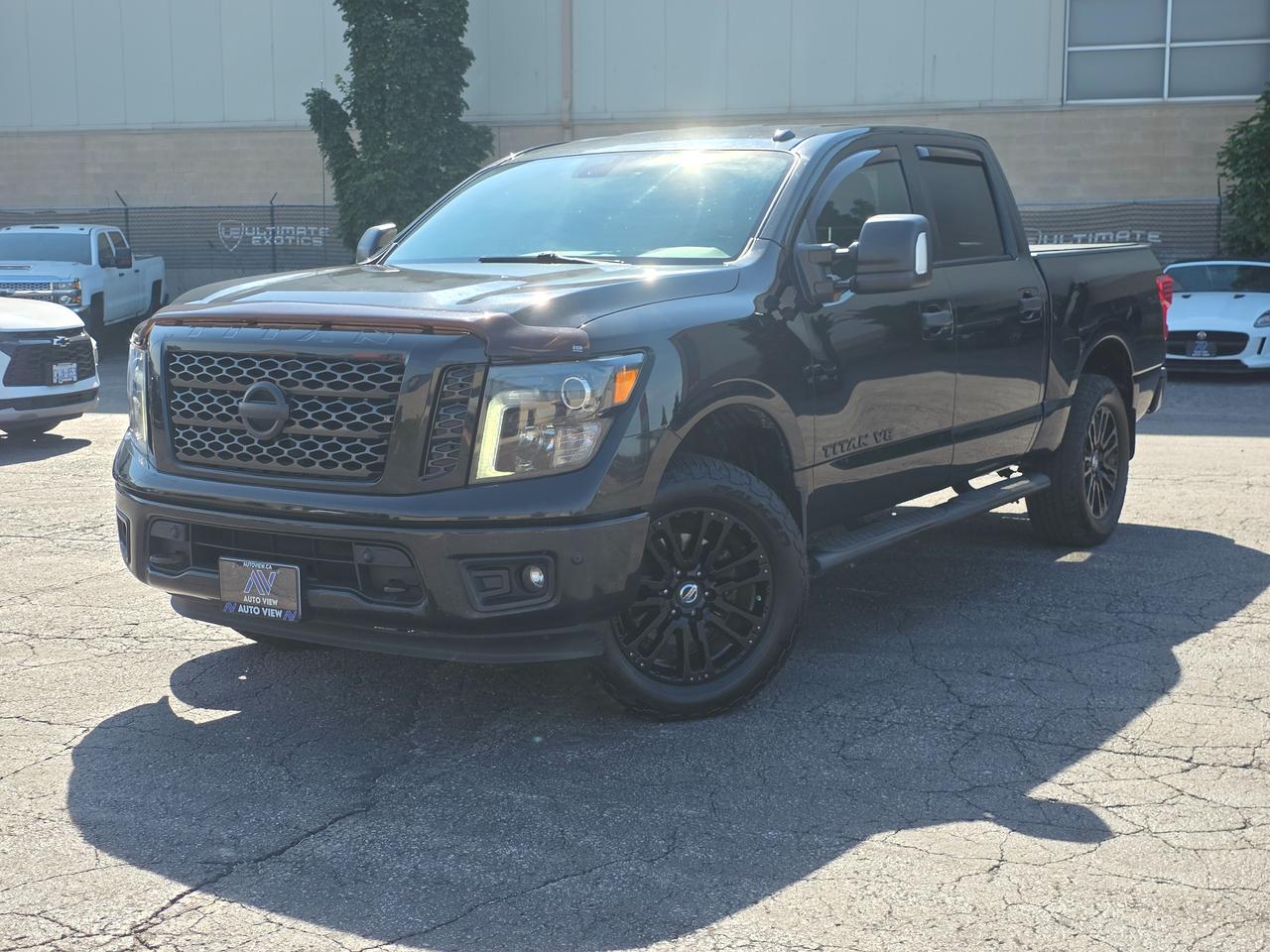 <p dir=ltr>JUST ARRIVED ON LOT!!</p><p dir=ltr>2018 Nissan Titan Midnight Edition</p><p dir=ltr>POWERFUL AND RELIABLE PICKUP TRUCK!!</p><p dir=ltr>The 2018 Nissan Titan SL Midnight Edition is a full-size, premium-tier pickup truck that combines a blacked-out aesthetic package with the luxury features of the high-end SL trim. Powered by a robust 5.6-litre Endurance&reg; V8 engine producing 390 horsepower and 394 lb-ft of torque, it is paired with a 7-speed automatic transmission.</p><p dir=ltr><strong>Key Specifications:</strong></p><p dir=ltr><strong>Engine</strong>: 5.6-liter naturally aspirated V8.</p><p dir=ltr><strong>Power:</strong> 390 hp and 394 lb-ft of torque.</p><p dir=ltr><strong>Transmission:</strong> 7-speed automatic.</p><p dir=ltr><strong>Fuel Economy:</strong> 15.6 city / 11.7 highway L/100km.</p><p dir=ltr><strong>Towing Capacity:</strong> Up to 9,230 lbs.</p><p dir=ltr><strong>The Midnight Edition Package:</strong></p><p dir=ltr>The Midnight Edition was offered as a factory appearance package for a retail price of $1,250 USD / $1,750 CAD. It features three paint options&mdash;Magnetic Black, Gun Metallic, and Pearl White&mdash;and includes the following custom blacked-out upgrades:</p><p dir=ltr><strong>Gloss Black Grille:</strong> Dark inner mesh insert replaces the standard chrome grille.</p><p dir=ltr><strong>20-inch Black Wheels:</strong> Exclusive 20-inch black painted aluminum-alloy wheels.</p><p dir=ltr><strong>Darkened Exterior Trims:</strong> Smoked dark headlights, black fog light surrounds, black side mirrors, and black door handles.</p><p dir=ltr><strong>Black Step Rails:</strong> Integrated running boards finished in black.</p><p dir=ltr><strong>Custom Badging:</strong> Blacked-out exterior TITAN and SL badges alongside a unique Midnight Edition tailgate logo.</p><p dir=ltr><strong>Body-Color Bumpers:</strong> Replaces standard chrome bumpers with body-matched paint.</p><p dir=ltr><strong>Premium SL Trim Features:</strong></p><p dir=ltr>Because it is built on the premium SL Trim, the truck comes standard with high-end luxury, utility, and safety equipment that sits just below the top-tier Platinum Reserve:</p><p dir=ltr><strong>Interior Luxury:</strong> Full charcoal leather-appointed seating, heated front bucket seats, an 8-way power drivers seat, and dual-zone automatic climate control.</p><p dir=ltr><strong>Premium Audio:</strong> A 12-speaker Rockford Fosgate premium audio system.</p><p dir=ltr><strong>Advanced Technology:</strong> NissanConnect with a 7-inch infotainment touchscreen, built-in navigation, and a rearview backup camera.</p><p dir=ltr><strong>Bed Utility:</strong> Nissans Utili-track&reg; channel system with 4 adjustable tie-down cleats, a factory spray-in bed liner, and a damped tailgate.</p><p dir=ltr><strong>Safety Suites:</strong> Blind Spot Warning (BSW), Rear Cross Traffic Alert (RCTA), and front/rear parking sonar sensors.</p><p dir=ltr>&nbsp;</p><p dir=ltr style=line-height: 1.2; margin-top: 12pt; margin-bottom: 12pt;><span style=font-size: 11pt; font-family: Roboto,sans-serif; color: #000000; background-color: transparent; font-weight: 400; font-style: italic; font-variant: normal; text-decoration: none; vertical-align: baseline; white-space: pre-wrap;>FINANCING AND LEASING AVAILABLE ON ALL CERTIFIED VEHICLES.</span></p><p dir=ltr style=line-height: 1.2; margin-top: 12pt; margin-bottom: 12pt;><span style=font-size: 11pt; font-family: Roboto,sans-serif; color: #000000; background-color: transparent; font-weight: 400; font-style: italic; font-variant: normal; text-decoration: none; vertical-align: baseline; white-space: pre-wrap;>HST and Licensing Fees are to be charged on all vehicles.&nbsp;</span></p><p dir=ltr style=line-height: 1.2; margin-top: 12pt; margin-bottom: 12pt;><span style=font-size: 11pt; font-family: Roboto,sans-serif; color: #000000; background-color: transparent; font-weight: 400; font-style: italic; font-variant: normal; text-decoration: none; vertical-align: baseline; white-space: pre-wrap;>All CERTIFIED vehicles come with a 36-day Safety Guarantee.</span></p><p dir=ltr style=line-height: 1.2; margin-top: 12pt; margin-bottom: 12pt;><span style=font-size: 11pt; font-family: Roboto,sans-serif; color: #000000; background-color: transparent; font-weight: 400; font-style: italic; font-variant: normal; text-decoration: none; vertical-align: baseline; white-space: pre-wrap;>ALL CERTIFIED VEHICLES COME WITH A BRONZE GLOBAL WARRANTY (3 MONTH / 3,000 KM / $1,000 PER CLAIM)</span></p><p dir=ltr style=line-height: 1.2; margin-top: 12pt; margin-bottom: 12pt;><span style=font-size: 11pt; font-family: Roboto,sans-serif; color: #000000; background-color: transparent; font-weight: 400; font-style: italic; font-variant: normal; text-decoration: none; vertical-align: baseline; white-space: pre-wrap;>EXTENDED GLOBAL WARRANTY OPTIONS AVAILABLE ON ALL CERTIFIED VEHICLES.</span></p><p dir=ltr style=line-height: 1.2; margin-top: 12pt; margin-bottom: 12pt;><span style=font-size: 11pt; font-family: Roboto,sans-serif; color: #000000; background-color: transparent; font-weight: 400; font-style: italic; font-variant: normal; text-decoration: none; vertical-align: baseline; white-space: pre-wrap;>Auto View is located at 590 South Service Road Stoney Creek, only minutes off the QEW Exit 83 Fruitland Road!</span></p><p dir=ltr style=line-height: 1.2; margin-top: 12pt; margin-bottom: 12pt;><span style=font-size: 11pt; font-family: Roboto,sans-serif; color: #000000; background-color: transparent; font-weight: 400; font-style: italic; font-variant: normal; text-decoration: none; vertical-align: baseline; white-space: pre-wrap;>Contact us VIA email, call, or text!</span></p><p dir=ltr style=line-height: 1.2; margin-top: 12pt; margin-bottom: 12pt;><span style=font-size: 11pt; font-family: Roboto,sans-serif; color: #000000; background-color: transparent; font-weight: 400; font-style: italic; font-variant: normal; text-decoration: none; vertical-align: baseline; white-space: pre-wrap;>sales@autoview.ca</span></p><p style=line-height: 1.2;><span id=docs-internal-guid-4ac04223-7fff-914d-3829-742cb49c2e1a></span></p><p dir=ltr style=line-height: 1.2; margin-top: 12pt; margin-bottom: 12pt;><span style=font-size: 11pt; font-family: Roboto,sans-serif; color: #000000; background-color: transparent; font-weight: 400; font-style: italic; font-variant: normal; text-decoration: none; vertical-align: baseline; white-space: pre-wrap;>905-379-4206</span></p>