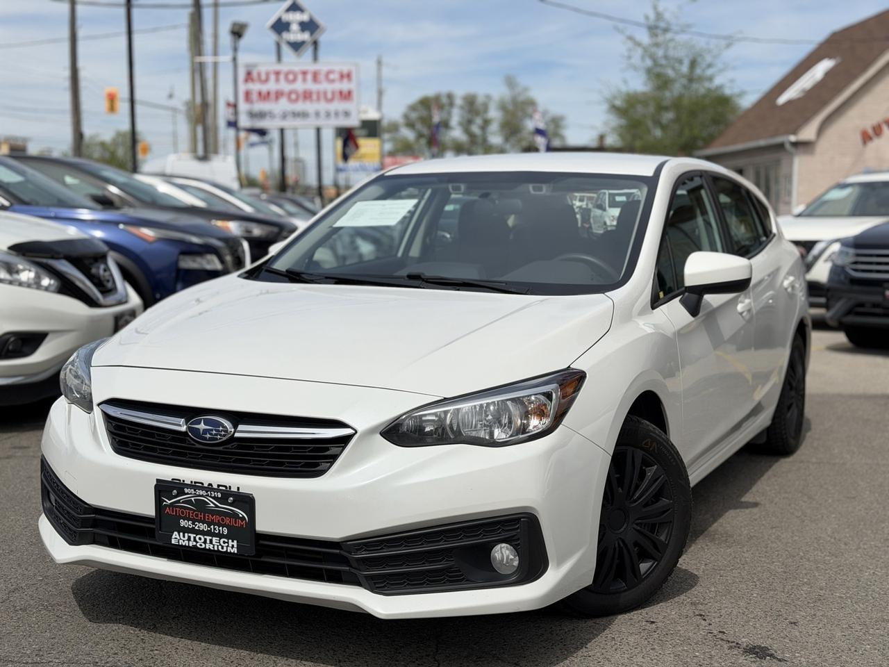 2022 Subaru Impreza Convenience AWD Pearl White w/ Eyesight Pkg   Lane Photo