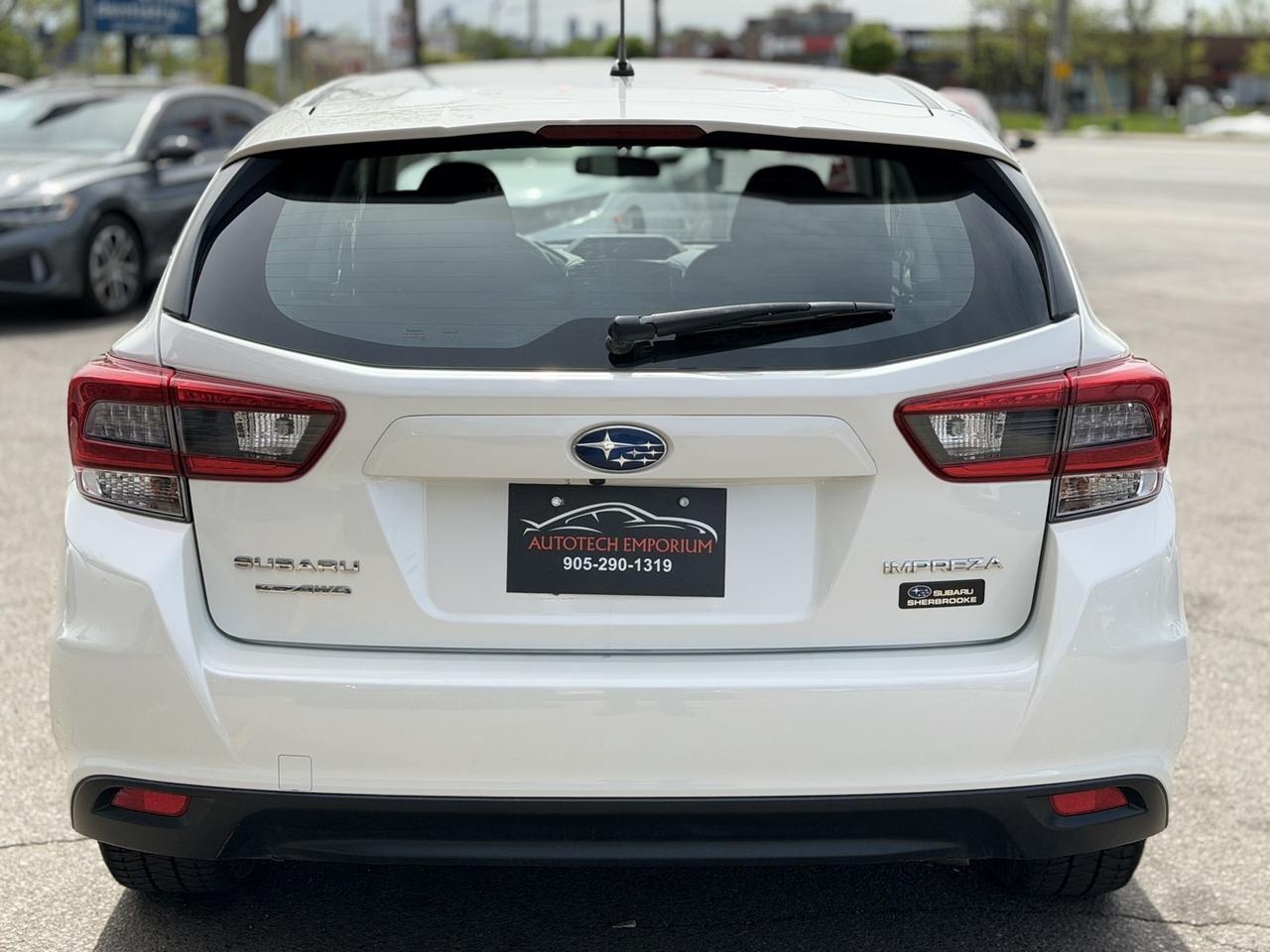 2022 Subaru Impreza Convenience AWD Pearl White w/ Eyesight Pkg   Lane Photo